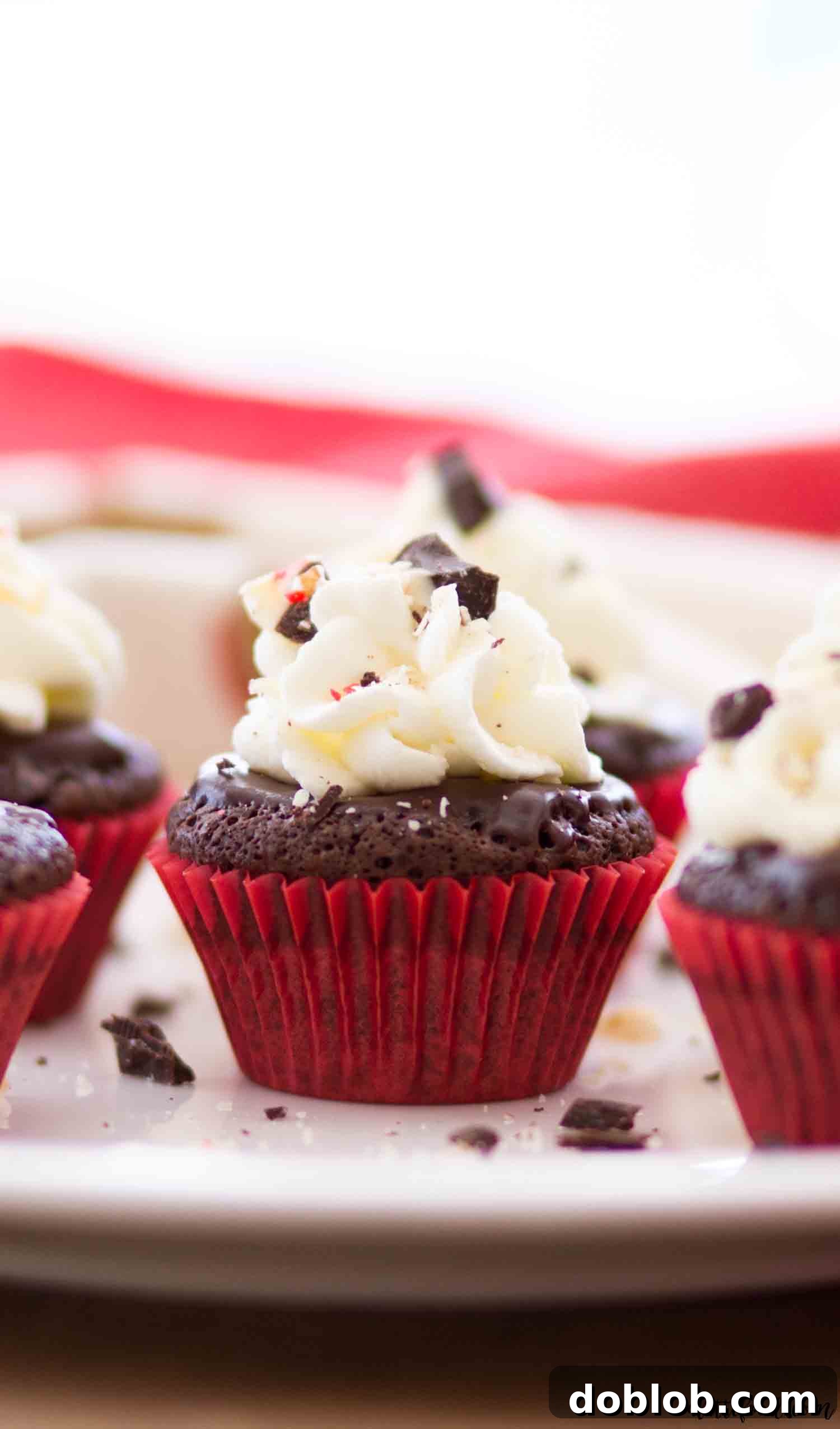 These mini flourless chocolate peppermint cupcakes are rich, fudgy, and a perfect gluten-free Christmas dessert with peppermint ganache and stabilized whipped cream frosting. #chocolate #dessert #glutenfree #cupcakes #peppermint Mini Flourless Chocolate Peppermint Cupcakes make the best gluten-free chocolate cupcakes, offering a delightful and convenient portion size for holiday gatherings.