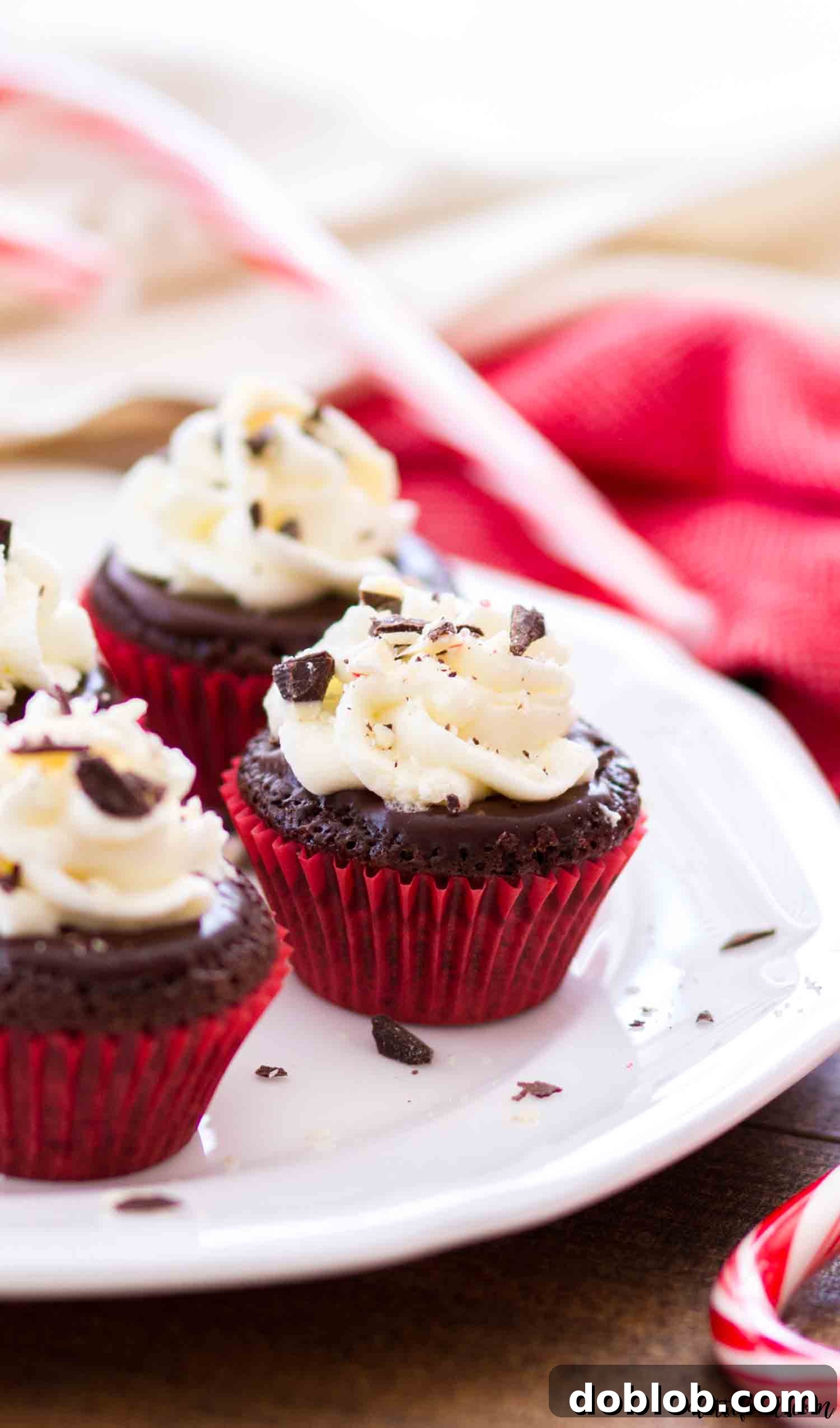 These mini flourless chocolate peppermint cupcakes are rich, fudgy, and a perfect gluten-free Christmas dessert with peppermint ganache and stabilized whipped cream frosting. #chocolate #dessert #glutenfree #cupcakes #peppermint These mini flourless chocolate peppermint cupcakes are rich, fudgy, and a perfect Christmas dessert, crowned with a vibrant peppermint ganache and a light, stabilized whipped cream frosting.