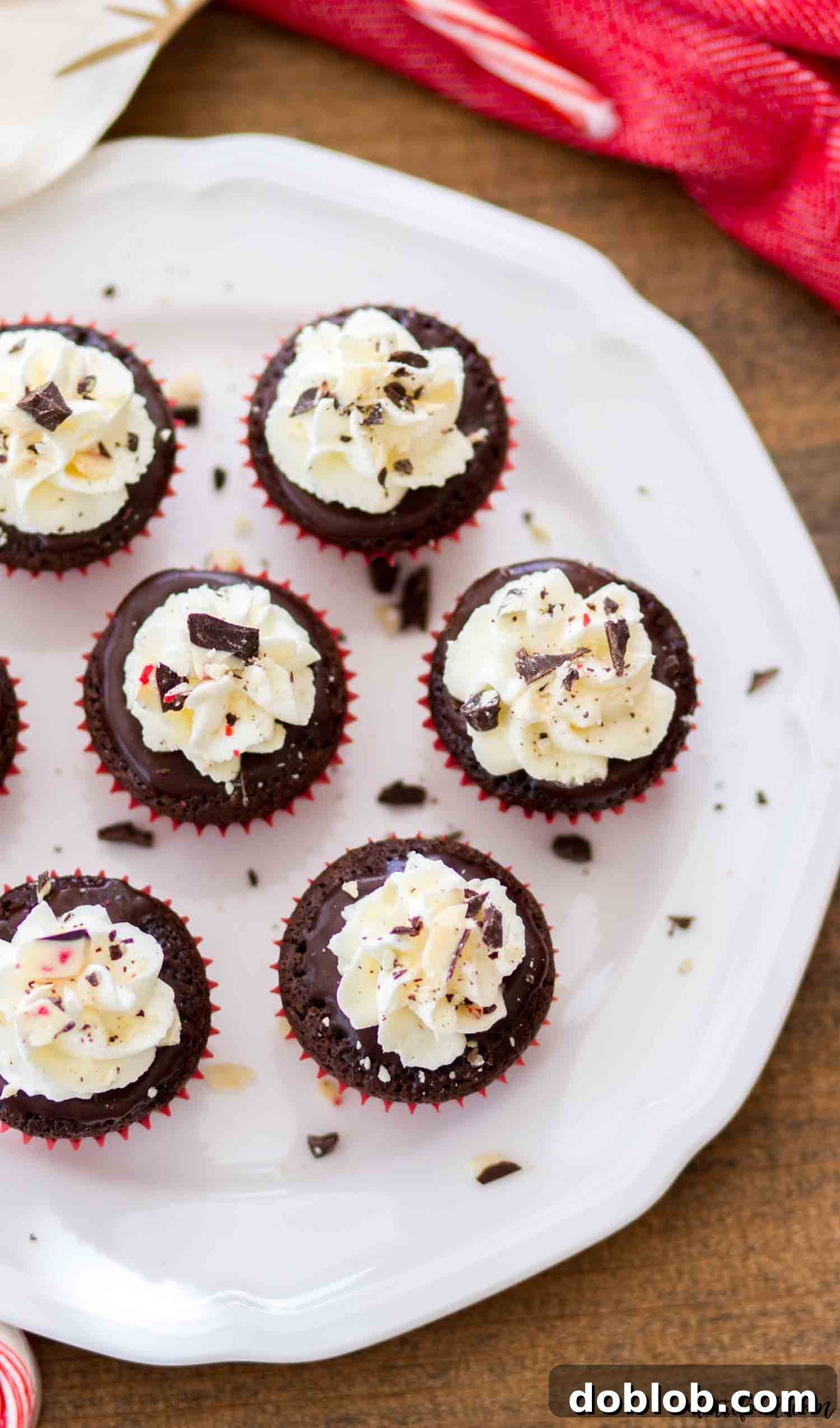 These mini flourless chocolate peppermint cupcakes are rich, fudgy, and a perfect gluten-free Christmas dessert with peppermint ganache and stabilized whipped cream frosting. #chocolate #dessert #glutenfree #cupcakes #peppermint These mini flourless chocolate peppermint cupcakes are rich, fudgy, and a perfect gluten-free Christmas dessert, beautifully adorned with peppermint ganache and stabilized whipped cream frosting.