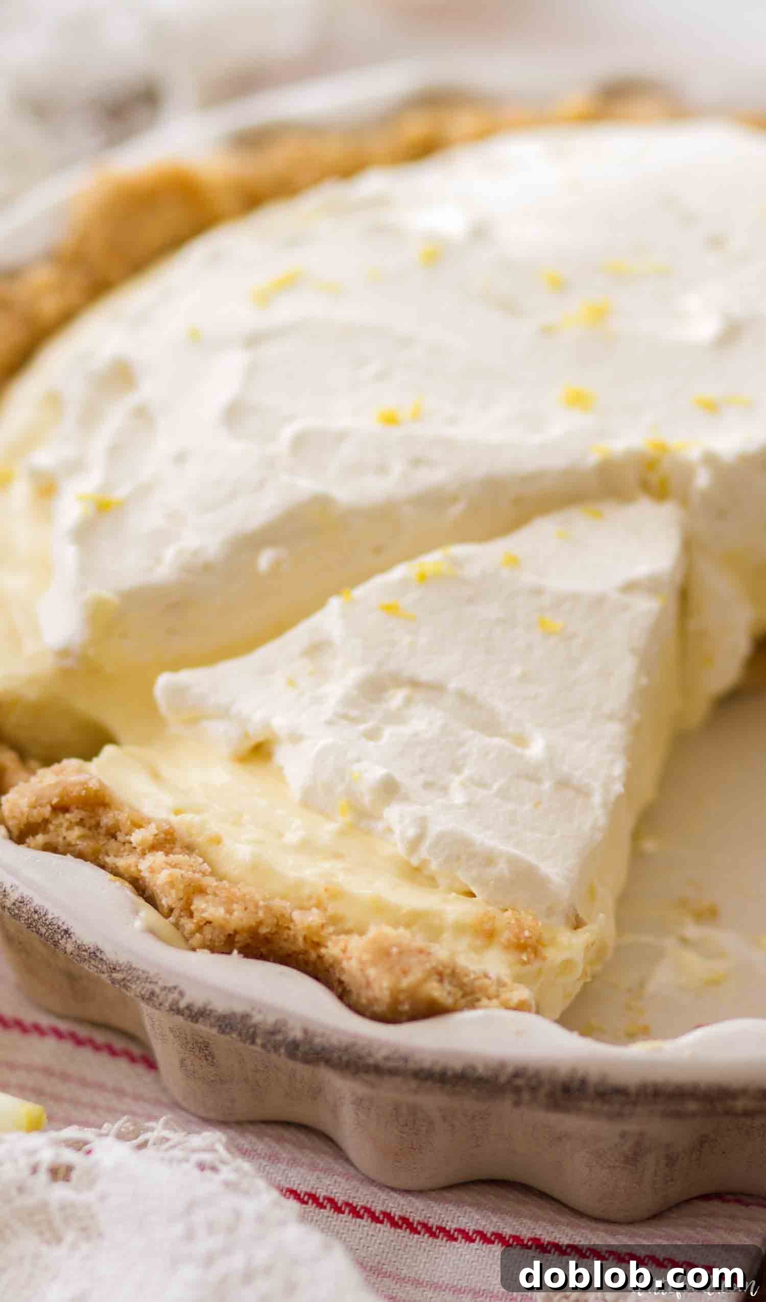 Delicious No-Bake Lemon Cream Pie with a Zesty, Creamy Filling. Homemade lemon cream pie in a vanilla wafer crust, ready to be served.