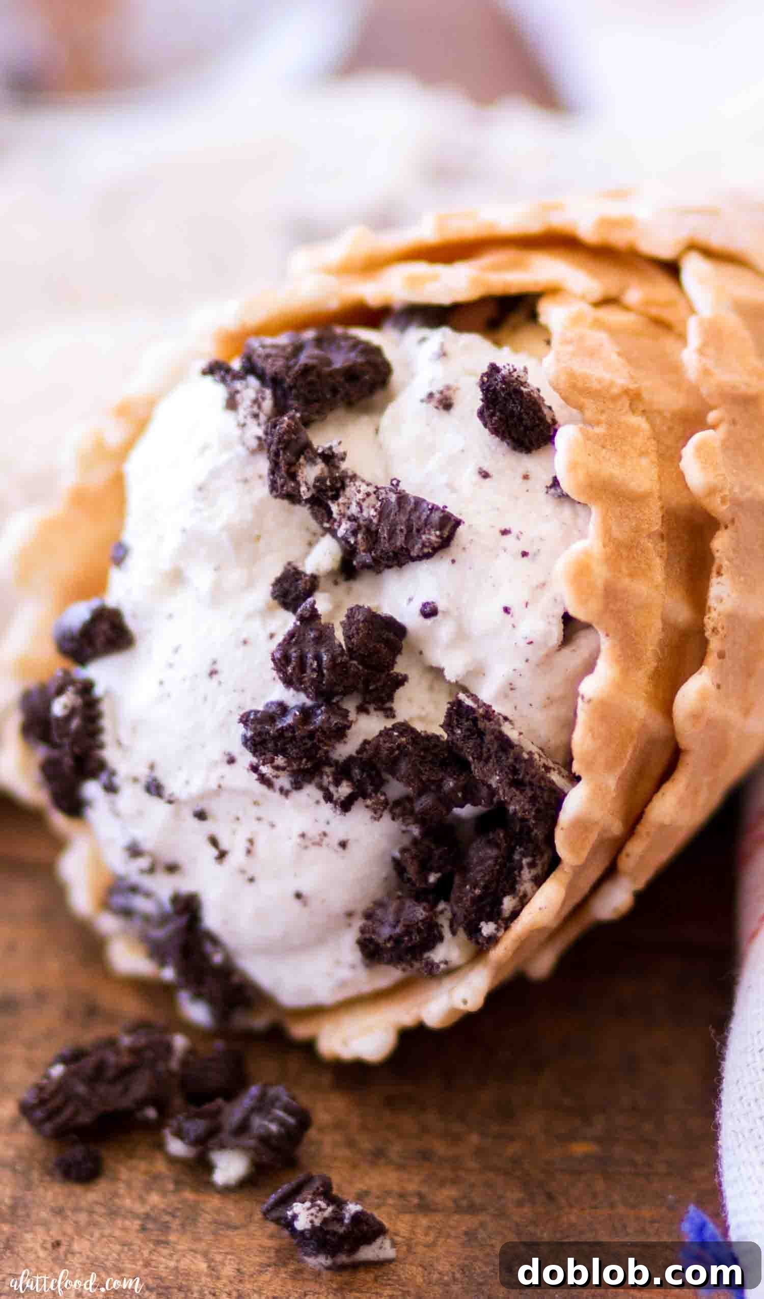 Four Deliciously Easy Ice Cream Sundae Recipes 7 Rich homemade cookies and cream ice cream overflowing from a crispy waffle cone, featuring large, enticing chunks of Oreo cookies for maximum flavor and texture