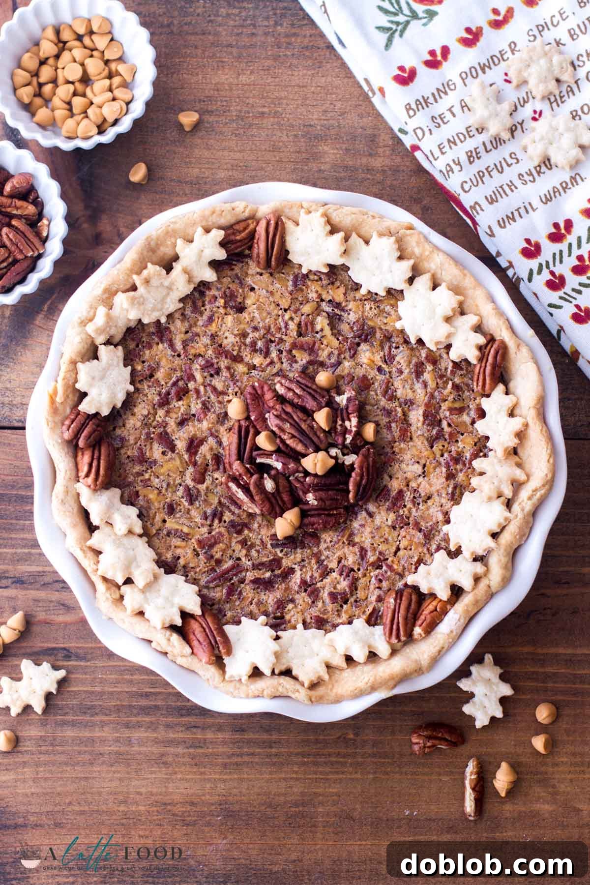 A whole Butterscotch Pecan Pie, artfully arranged in a pie dish with toasted pecans, resting on a rustic wooden board, ready to be enjoyed.
