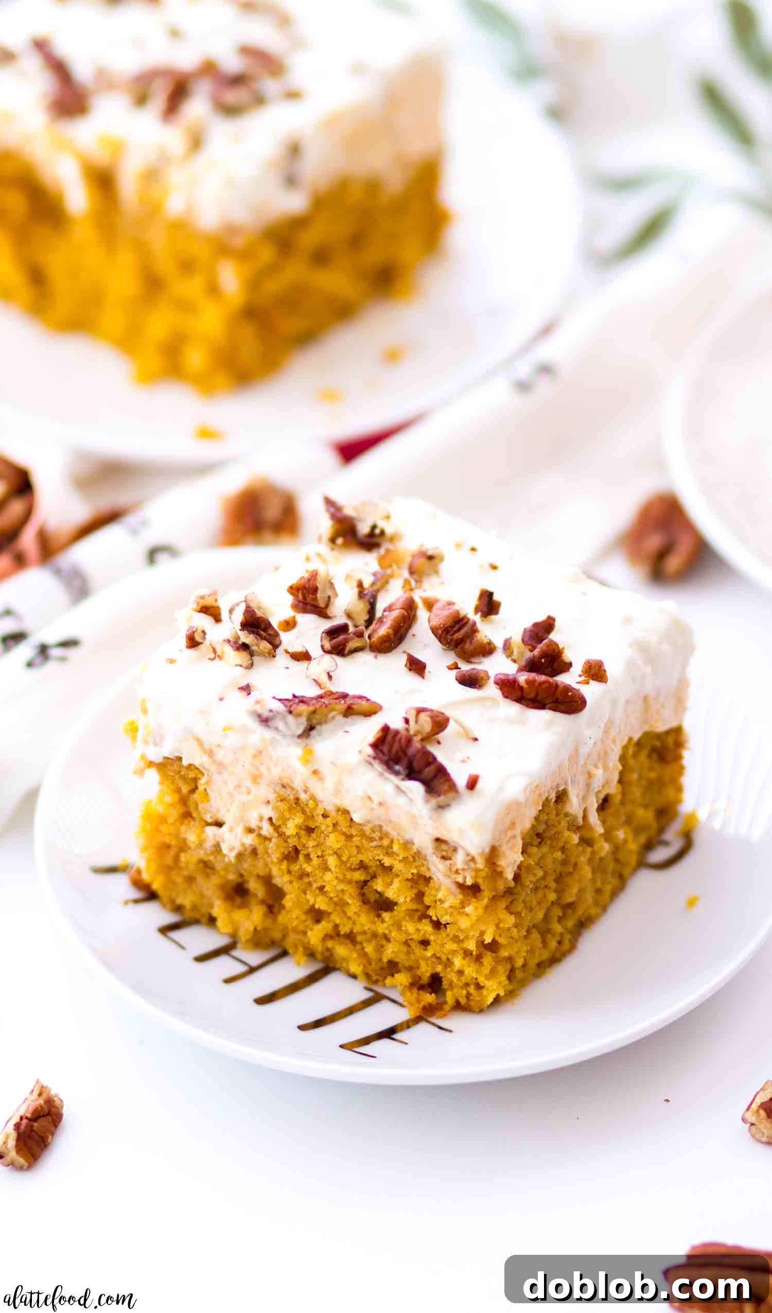 slice of pumpkin poke cake with pumpkin filling