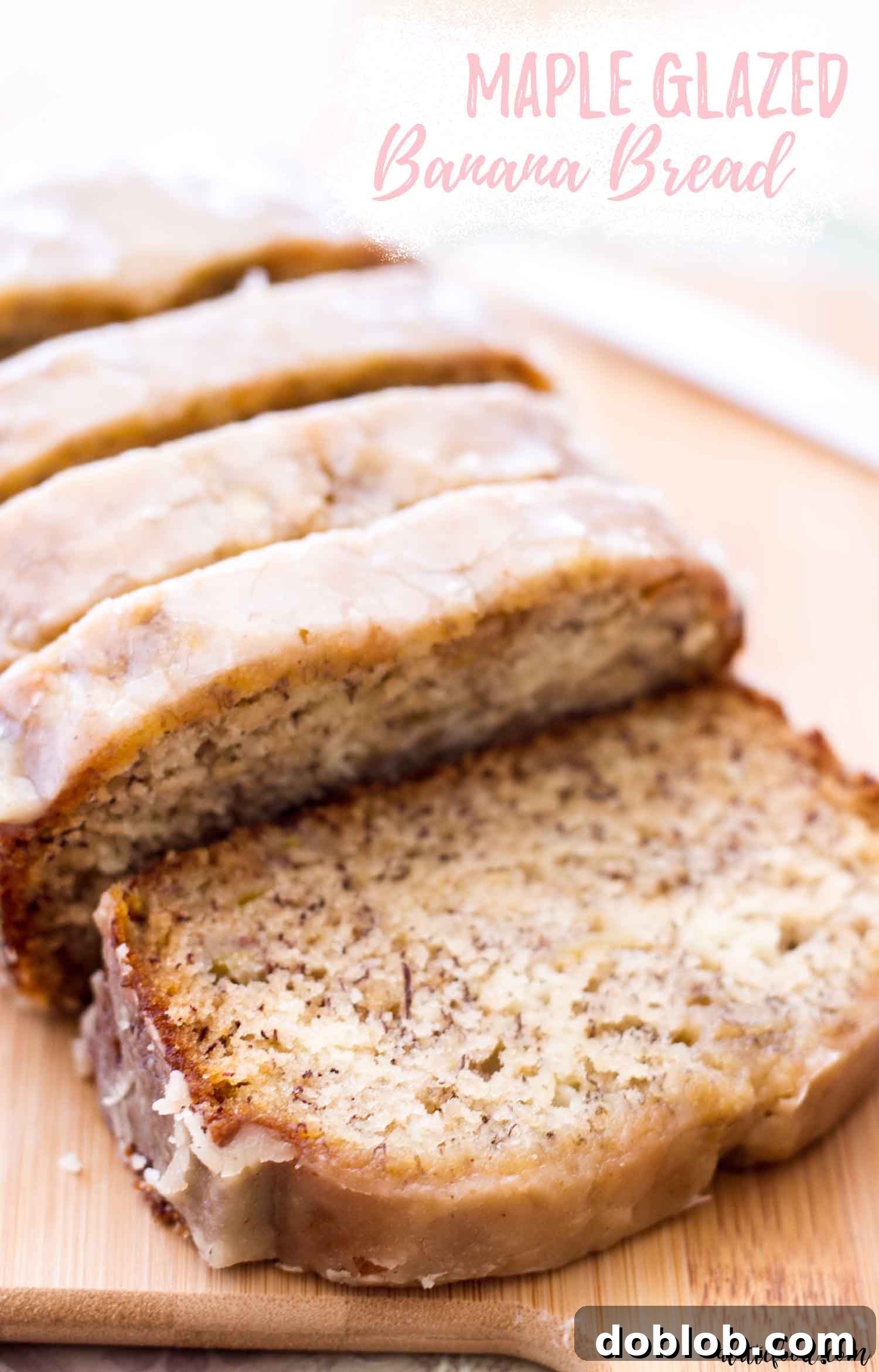 If you love a classic banana bread recipe then you are going to flip for this Maple Glazed Banana Bread! It’s a super moist banana bread recipe made without sour cream and it’s topped with a maple glaze made with real maple syrup. One of my favorite easy baking recipes! banana bread loaf sliced on wooden board with text