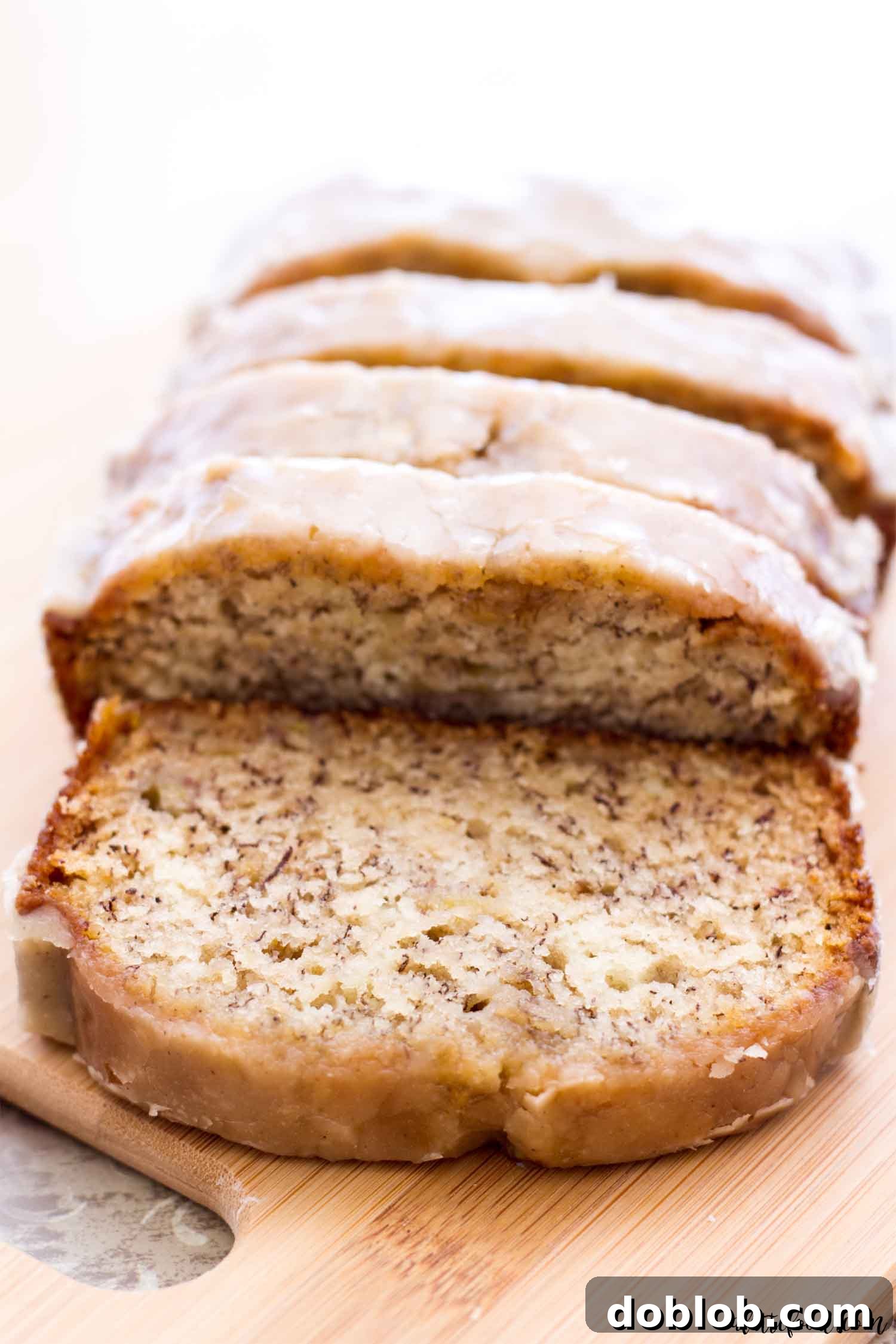 Maple Drizzled Banana Bread Bliss 2 maple banana bread sliced on cutting board
