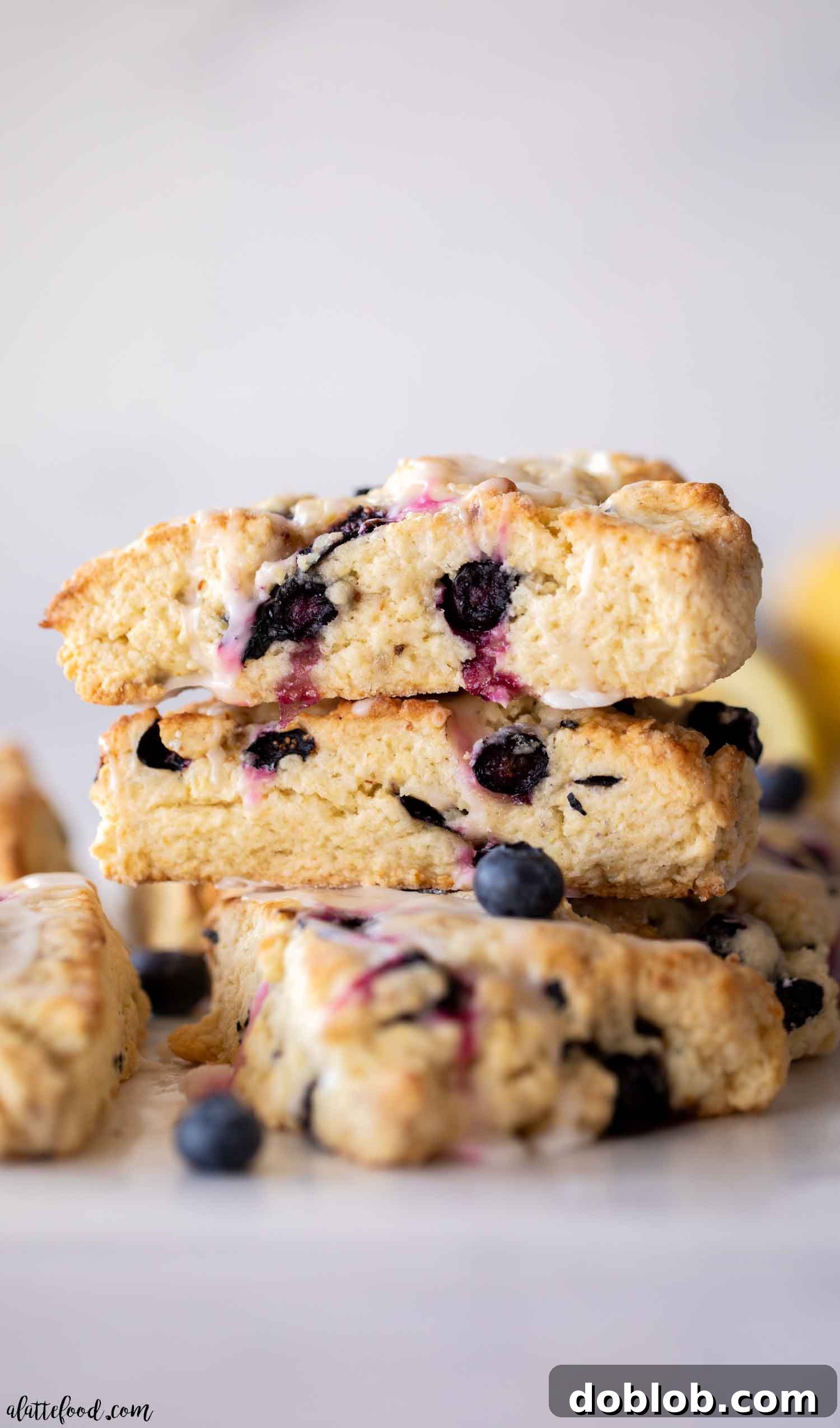 Sweet Honey Pistachio Delights with Cream Cheese 4 Fresh blueberry lemon scones stacked on parchment paper