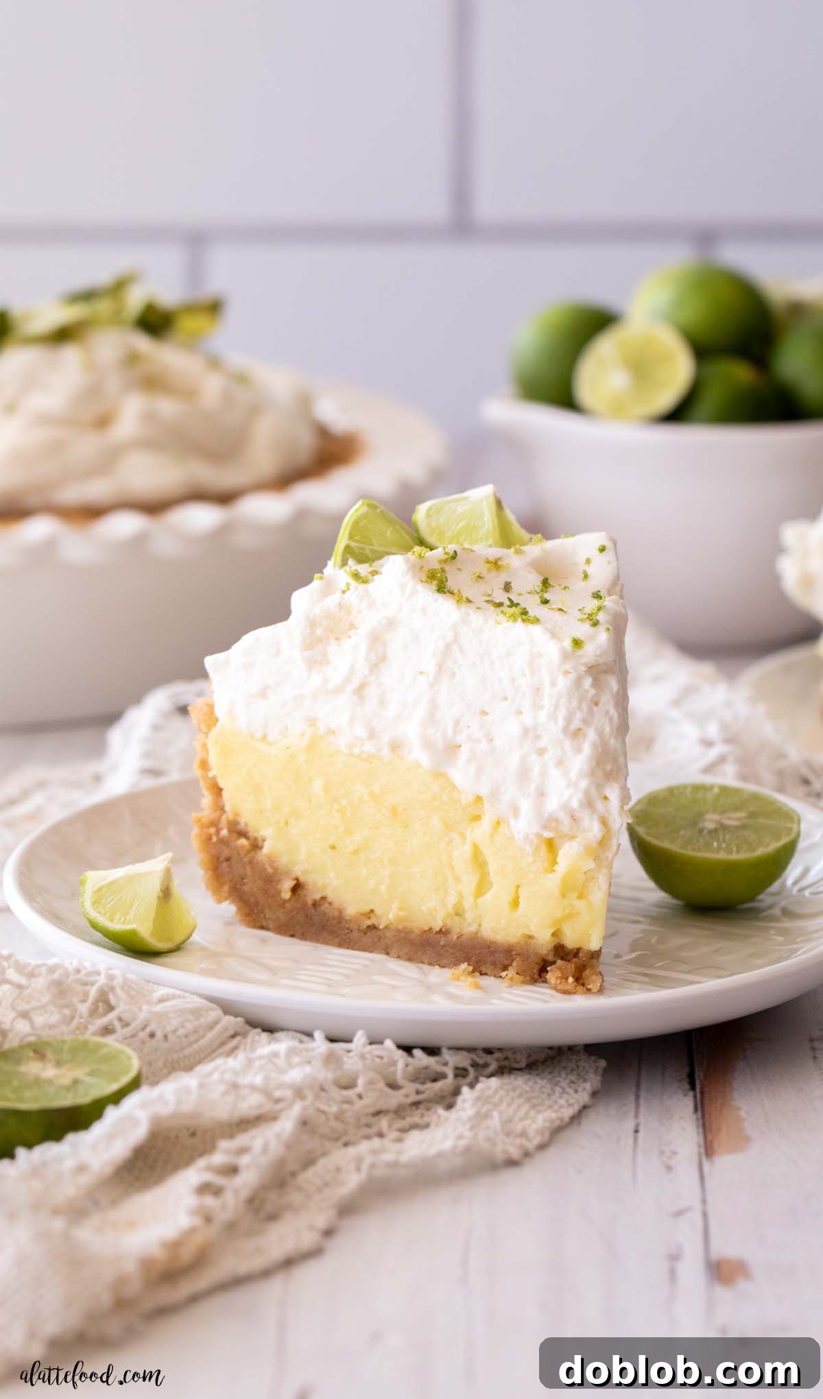 deep dish key lime pie slice on a white plate