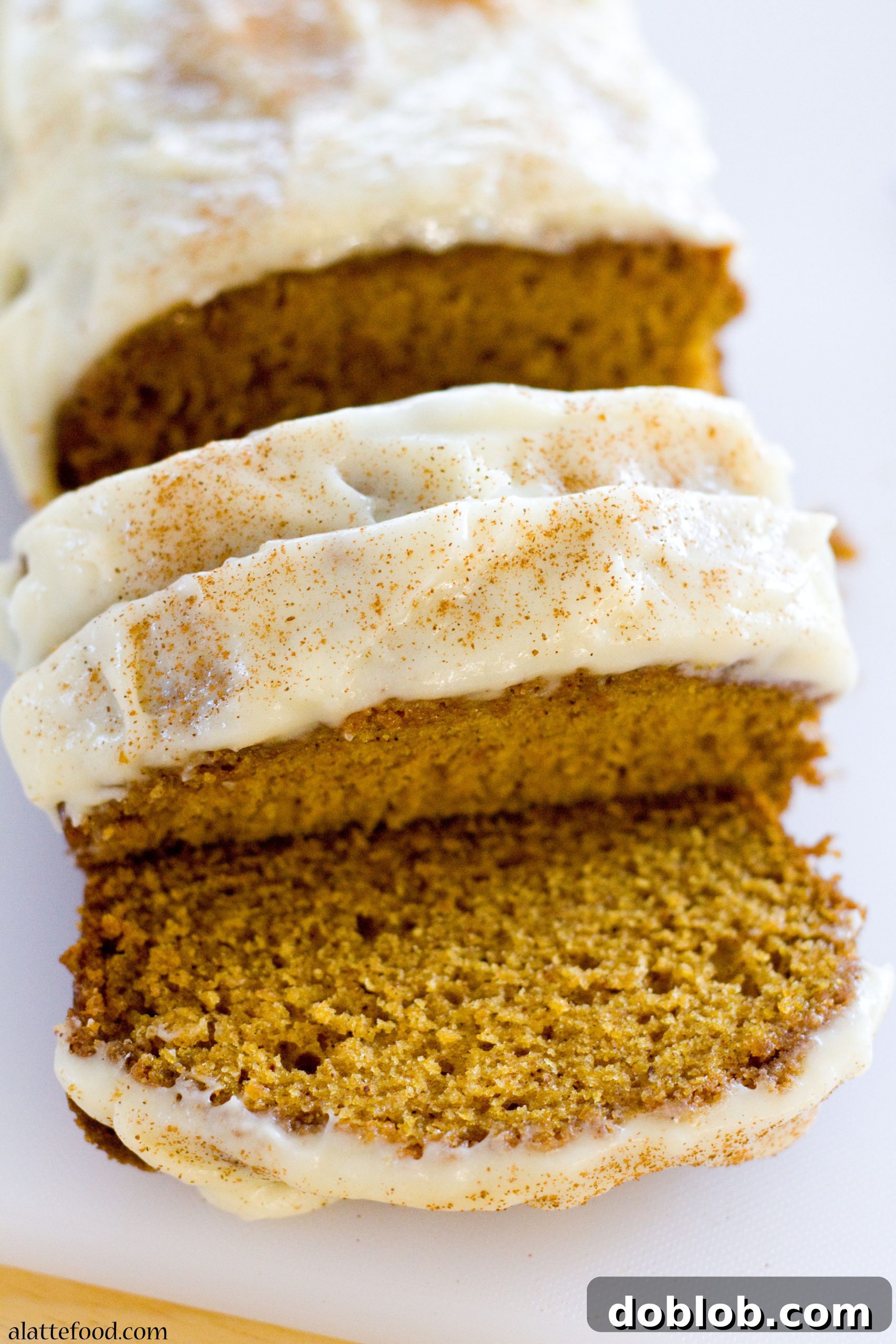 A close-up of a loaf of Classic Pumpkin Streusel Bread, showcasing the cinnamon streusel.