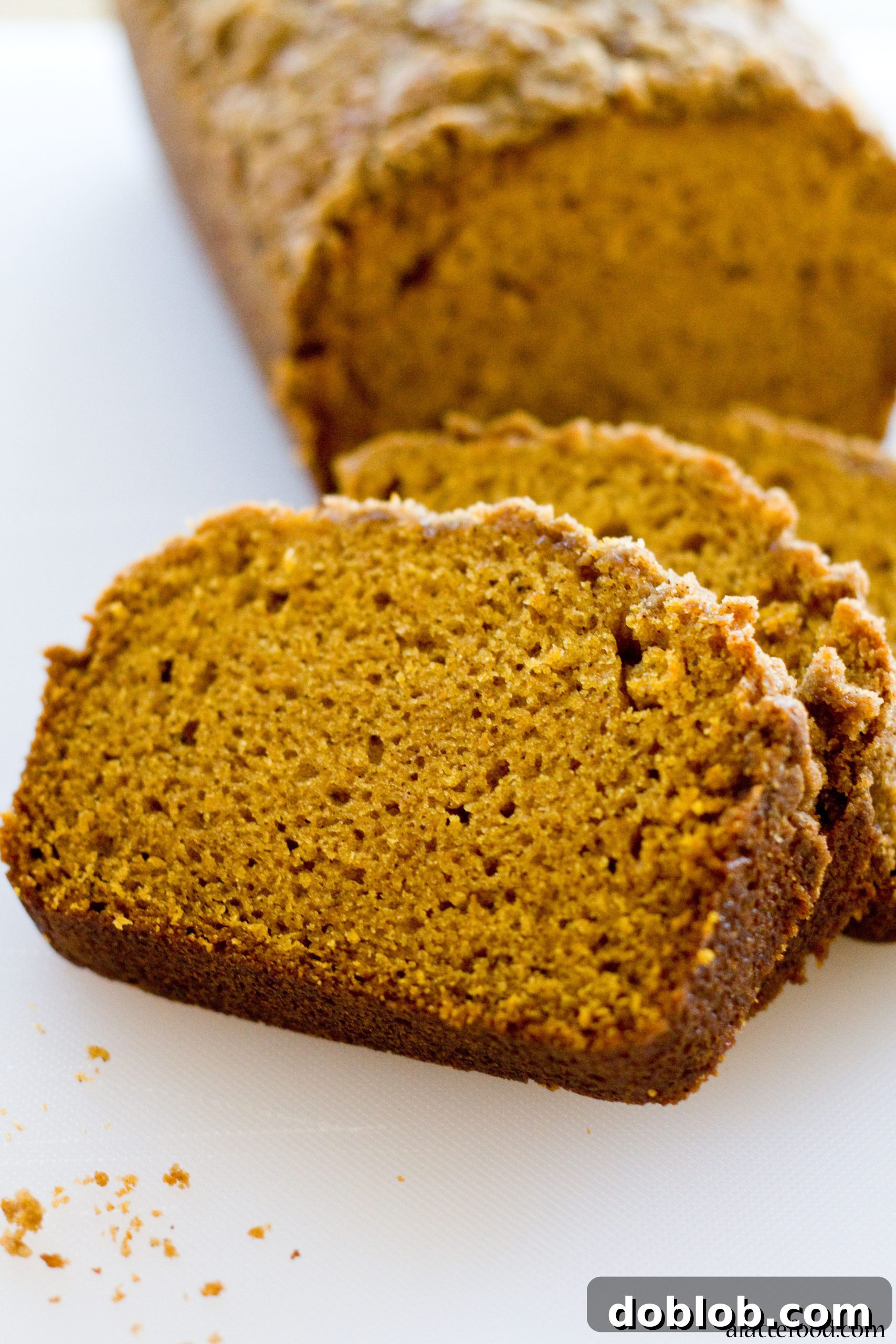 Freshly baked Classic Pumpkin Streusel Bread cooling on a wire rack.