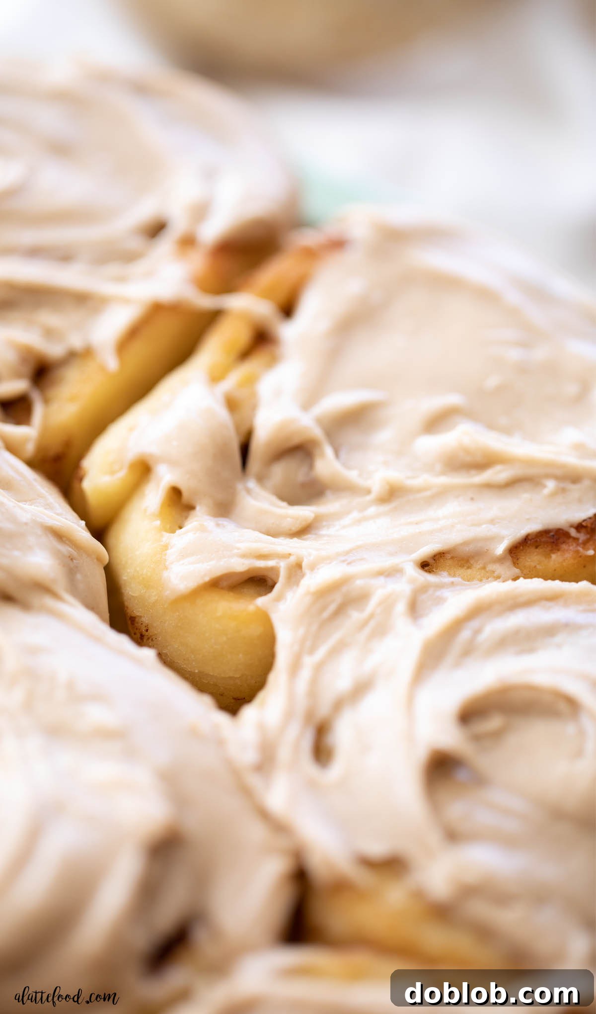 baked pumpkin butter cinnamon rolls with brown sugar icing
