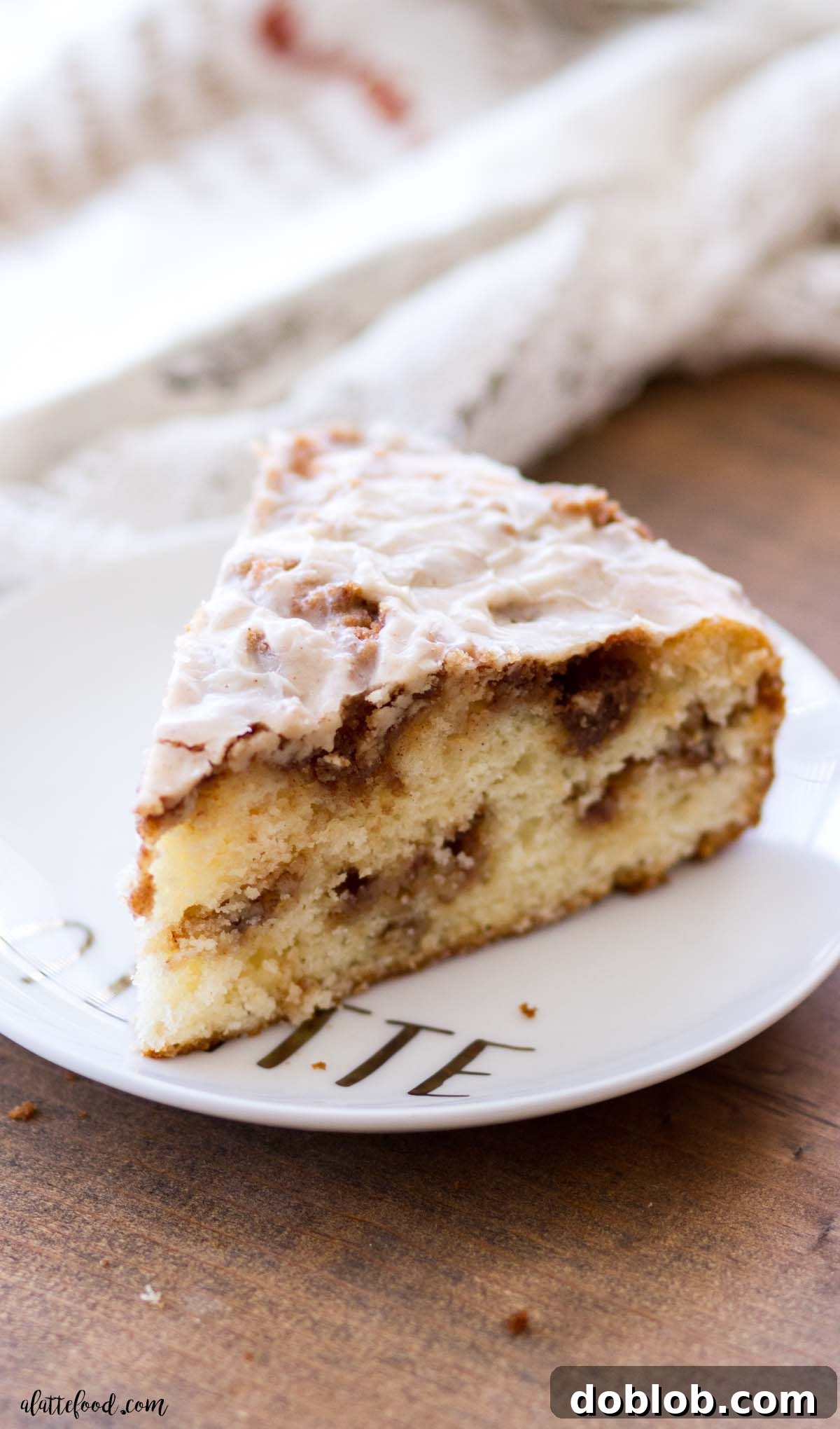 cinnamon swirled cake slice on wooden board