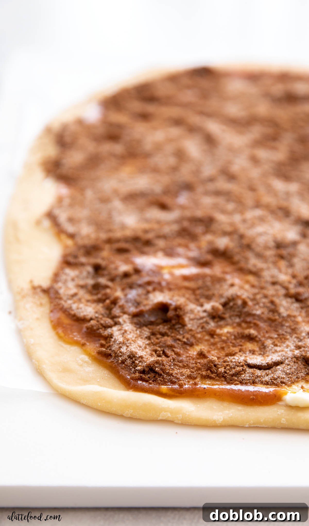 pumpkin butter and cinnamon sugar spread on rolled out dough