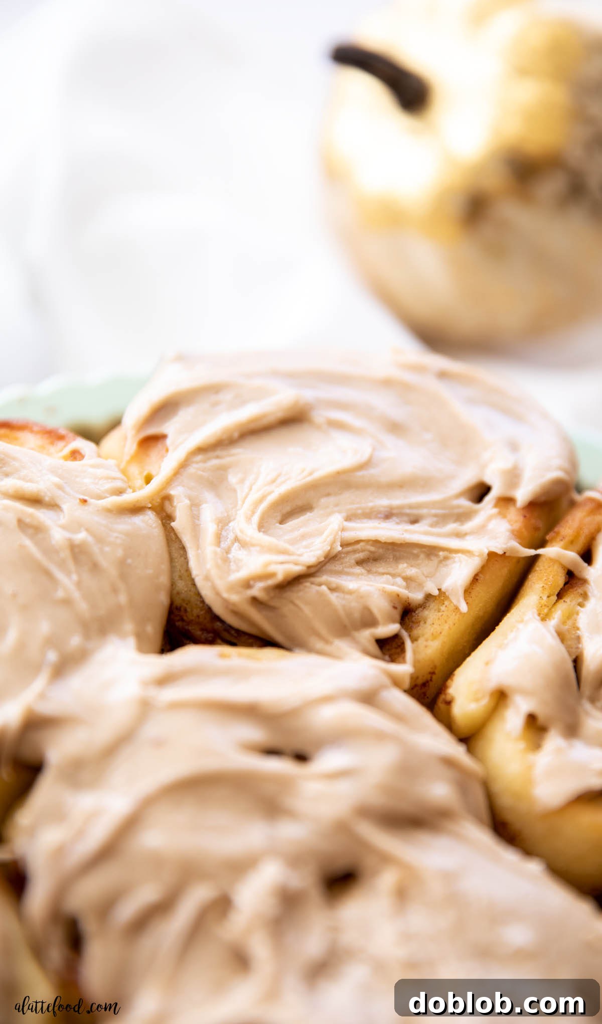 brown sugar pumpkin butter cinnamon rolls in sage baking dish