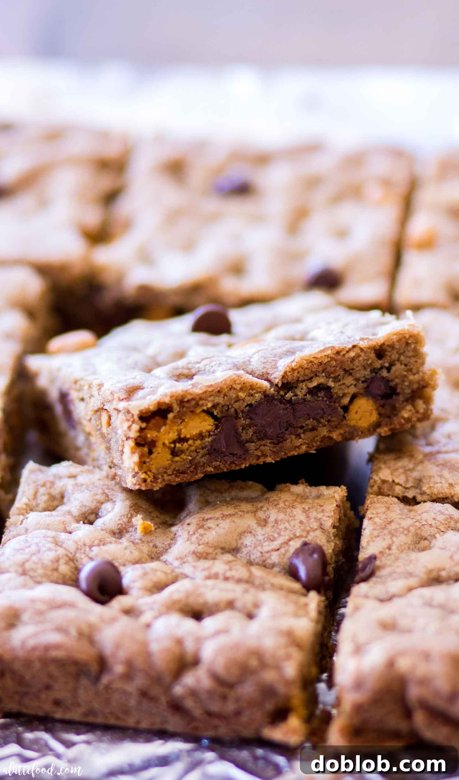 cookie bars with chocolate chips and butterscotch stacked