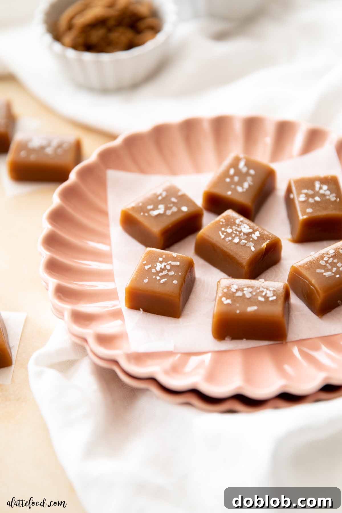 Caramels with sea salt on parchment paper.
