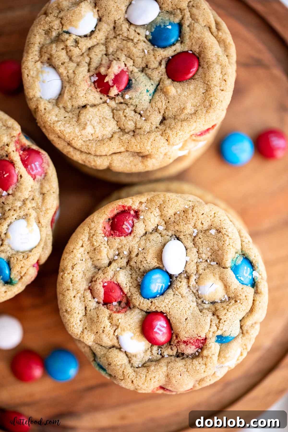 Close-up of a delightful M&M cookie ice cream sandwich, showcasing the vibrant cookies, creamy vanilla ice cream, and colorful M&Ms.