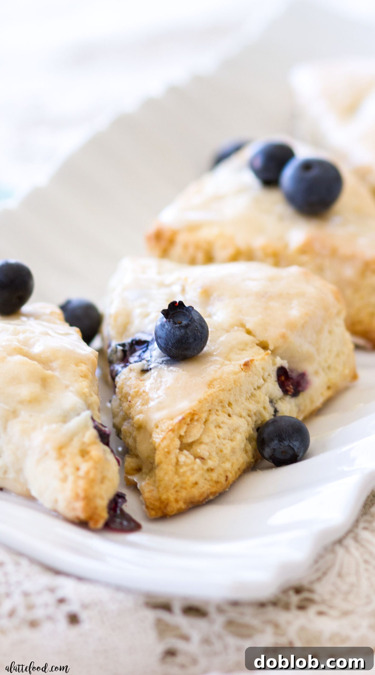 Dreamsicle Orange Cream Scones 11 Blueberry Cream Cheese Scones on a white serving dish