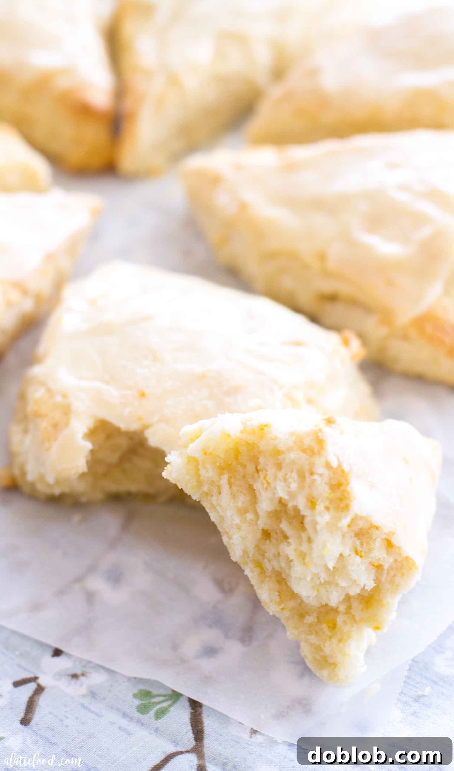 Dreamsicle Orange Cream Scones 5 Close-up of a fluffy orange cream scone cut in half, revealing its tender, flaky interior