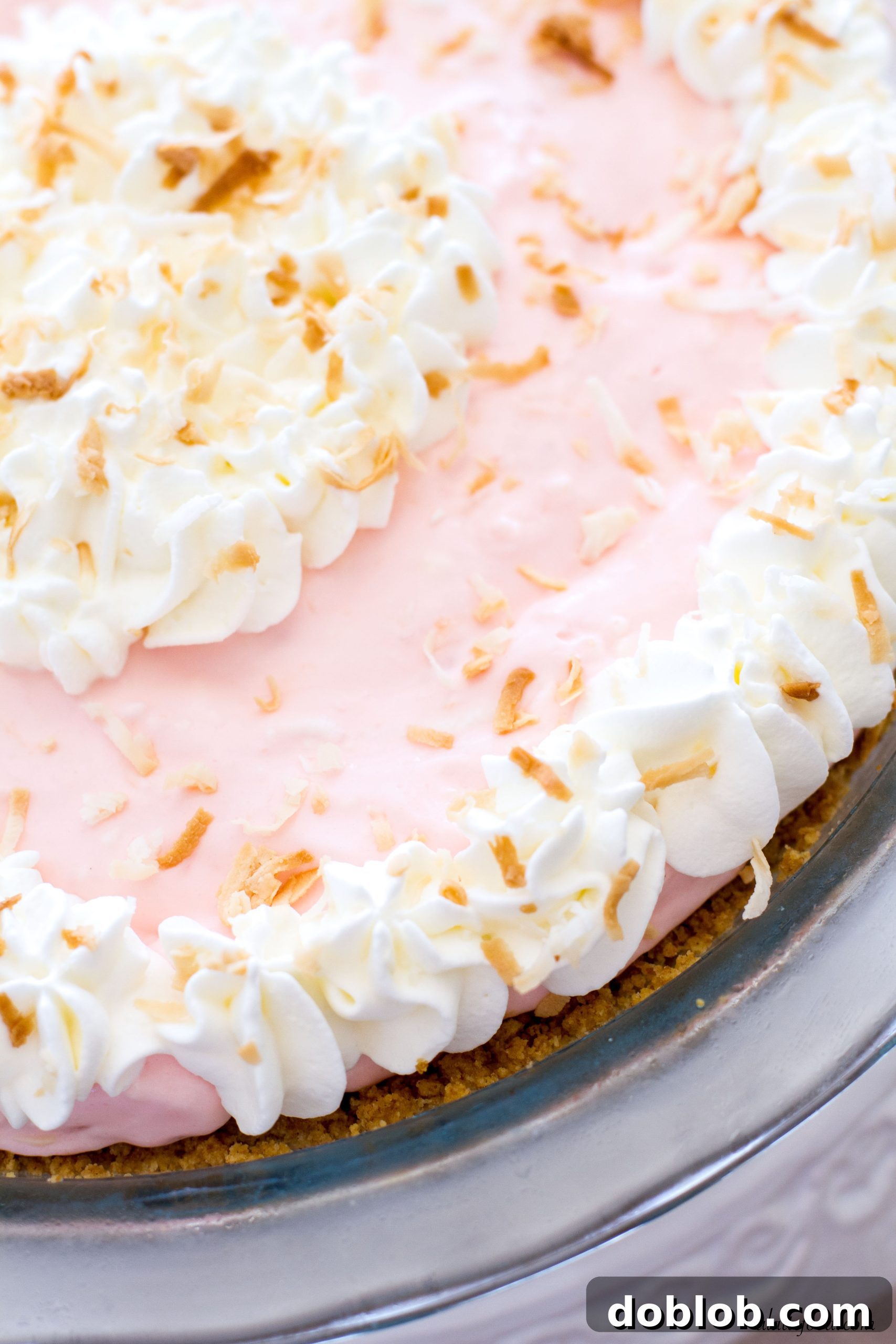 Finished No-Bake Tropical Cream Pie on a serving platter, ready to be enjoyed.