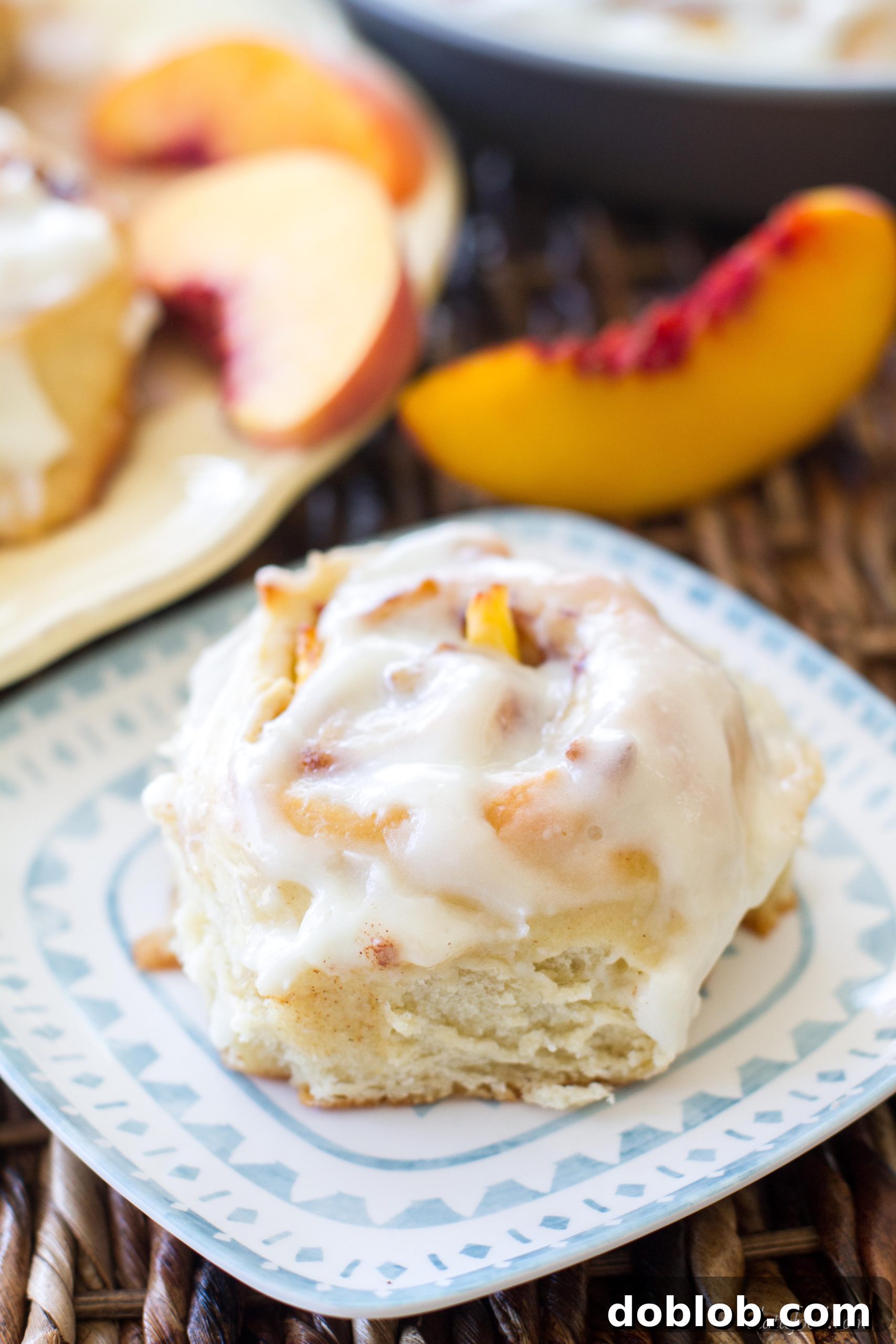 Freshly baked Peach Cinnamon Rolls with a Cream Cheese Glaze.