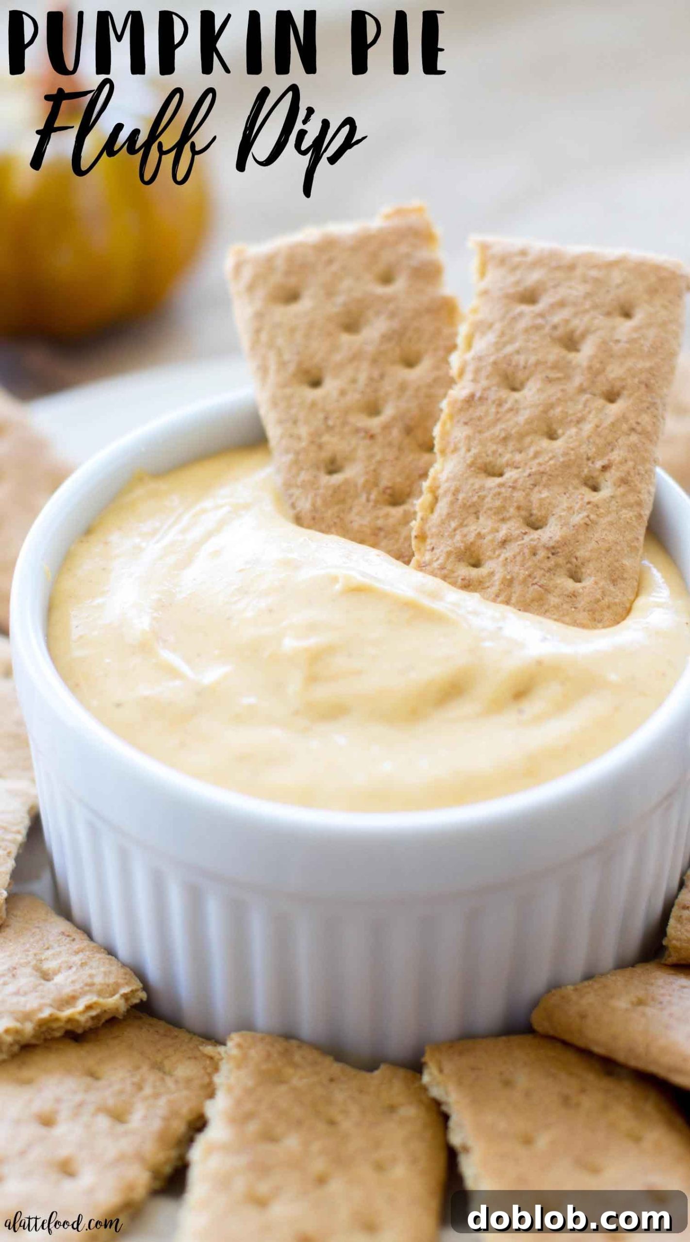 Dreamy Pumpkin Cloud Dip 6 A bowl of pumpkin pie fluff dip, showcasing its smooth, creamy consistency