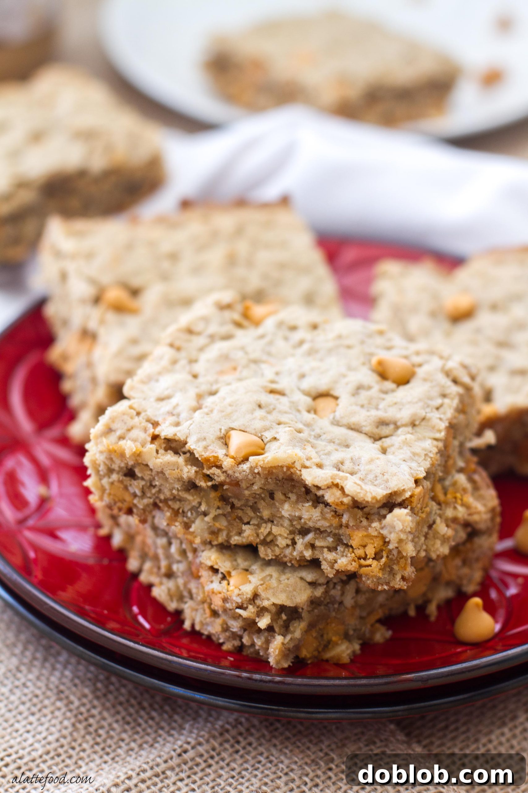 These oatmeal cookie bars are made with maple peanut butter and butterscotch chips to make an irresistible dessert!