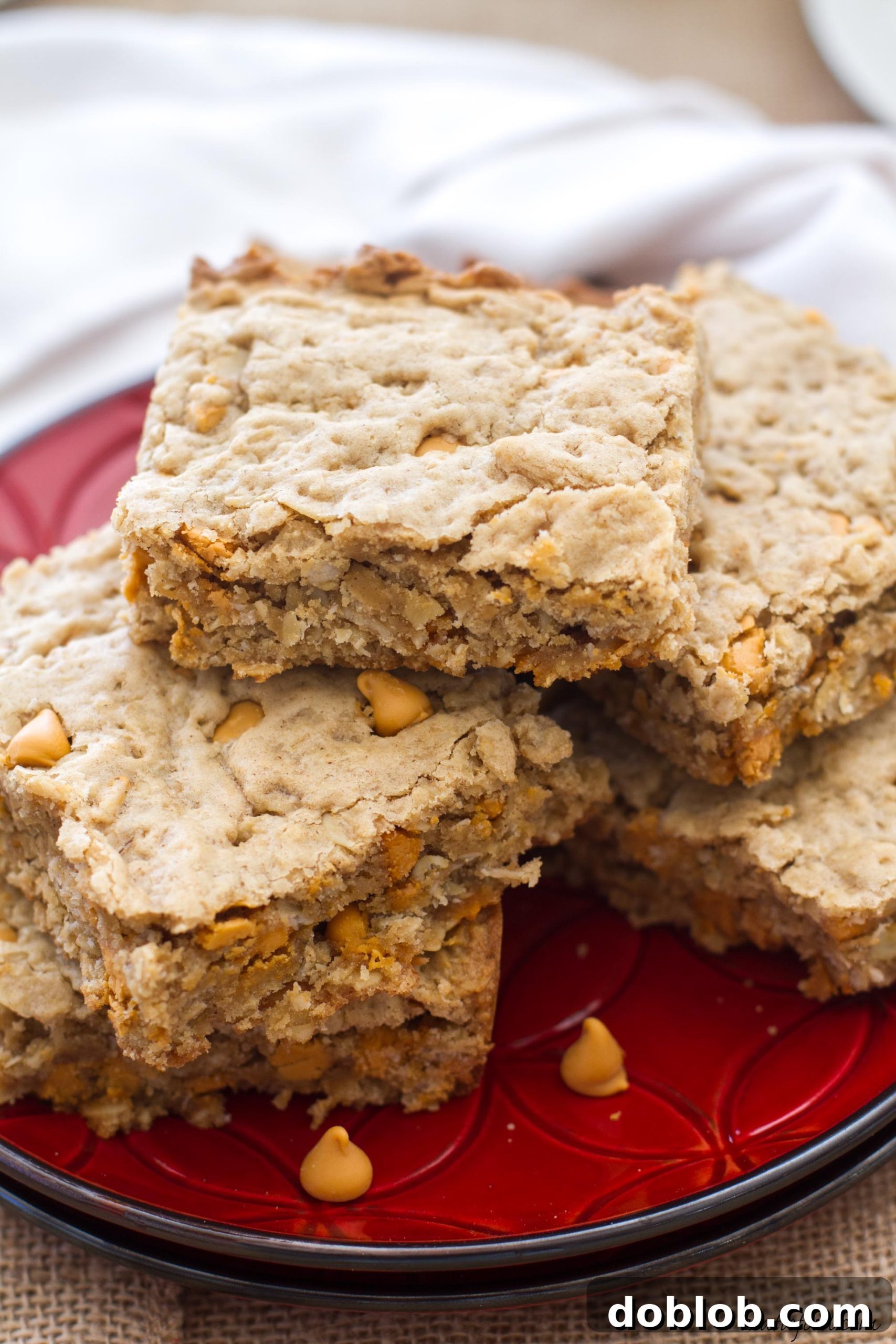 These oatmeal cookie bars are made with maple peanut butter and butterscotch chips to make an irresistible dessert!