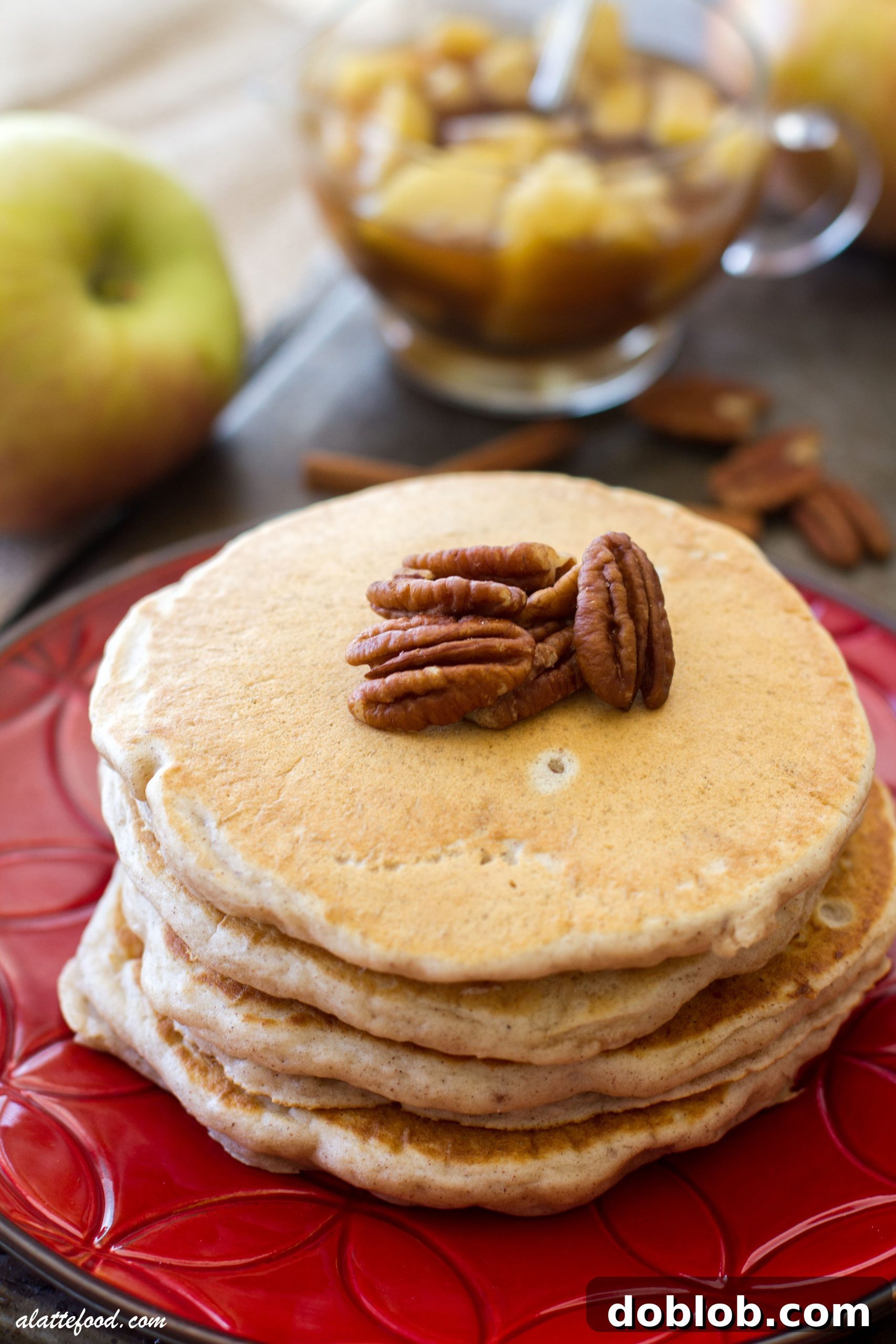 Pancakes with pecan and apple syrup, showcasing the rich texture and appealing presentation.