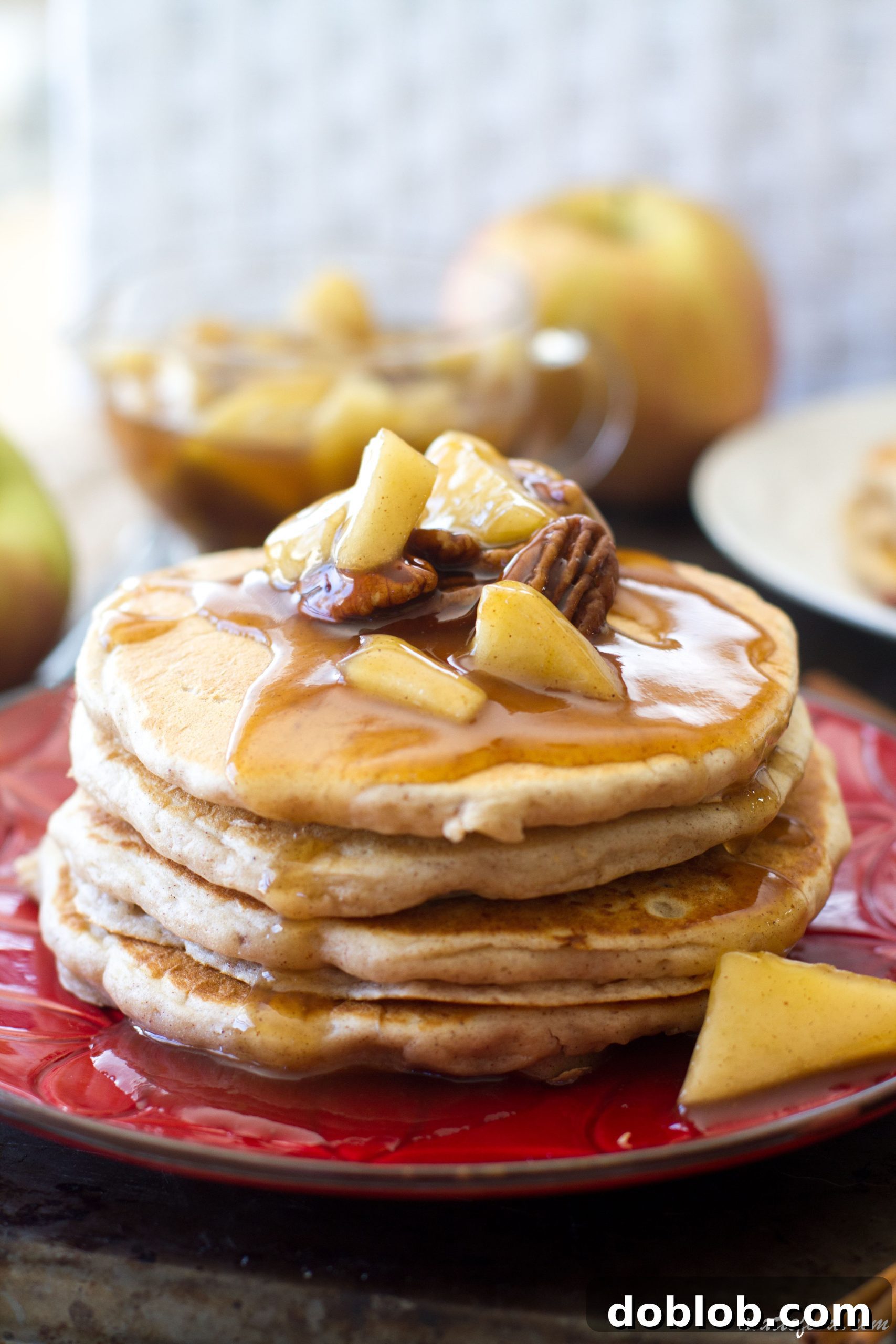 A freshly made stack of Pecan Pie Pancakes with Apple Cinnamon Syrup, ready to eat.