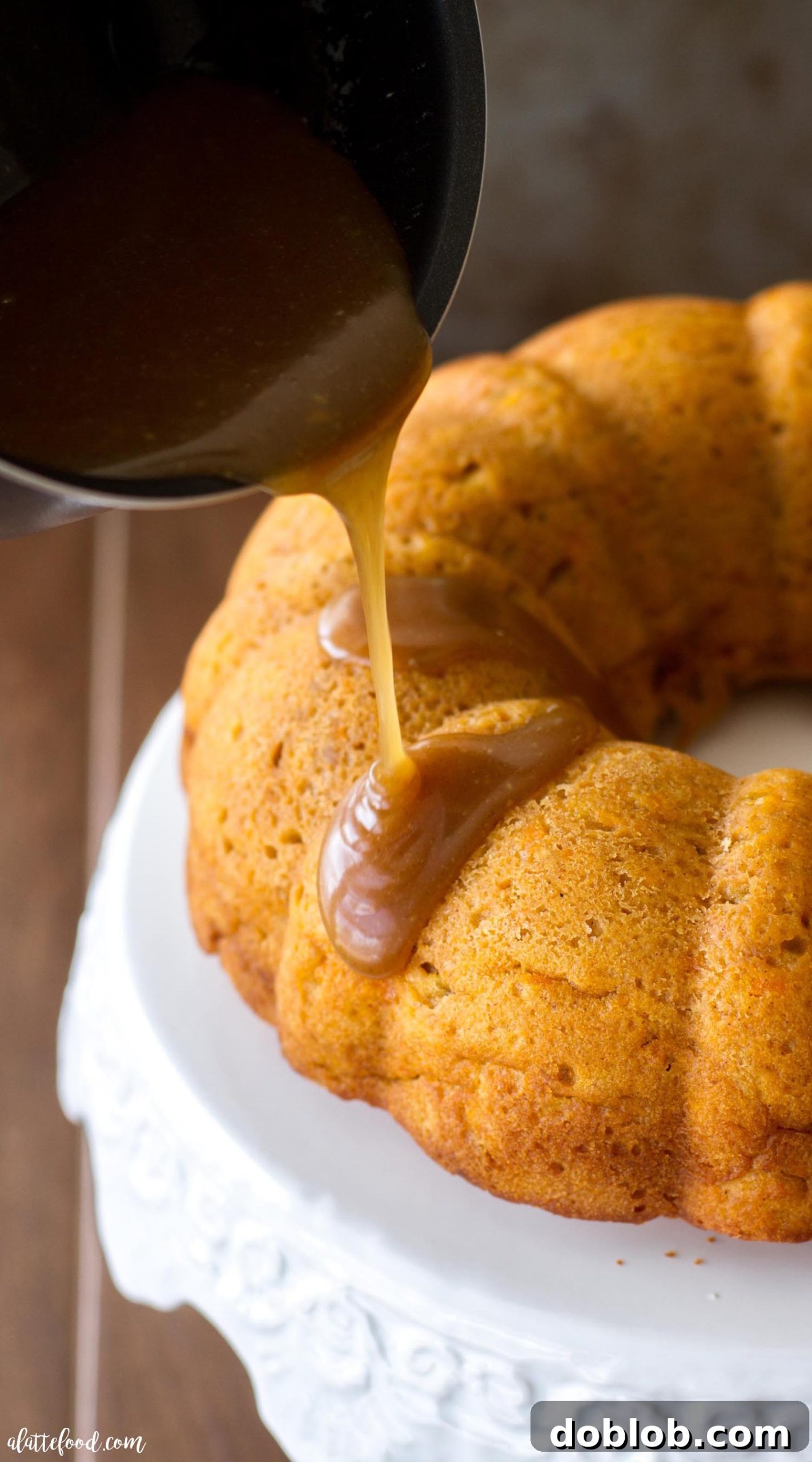 A close-up of a slice of sweet potato bundt cake, showing its moist texture and golden-brown crust.