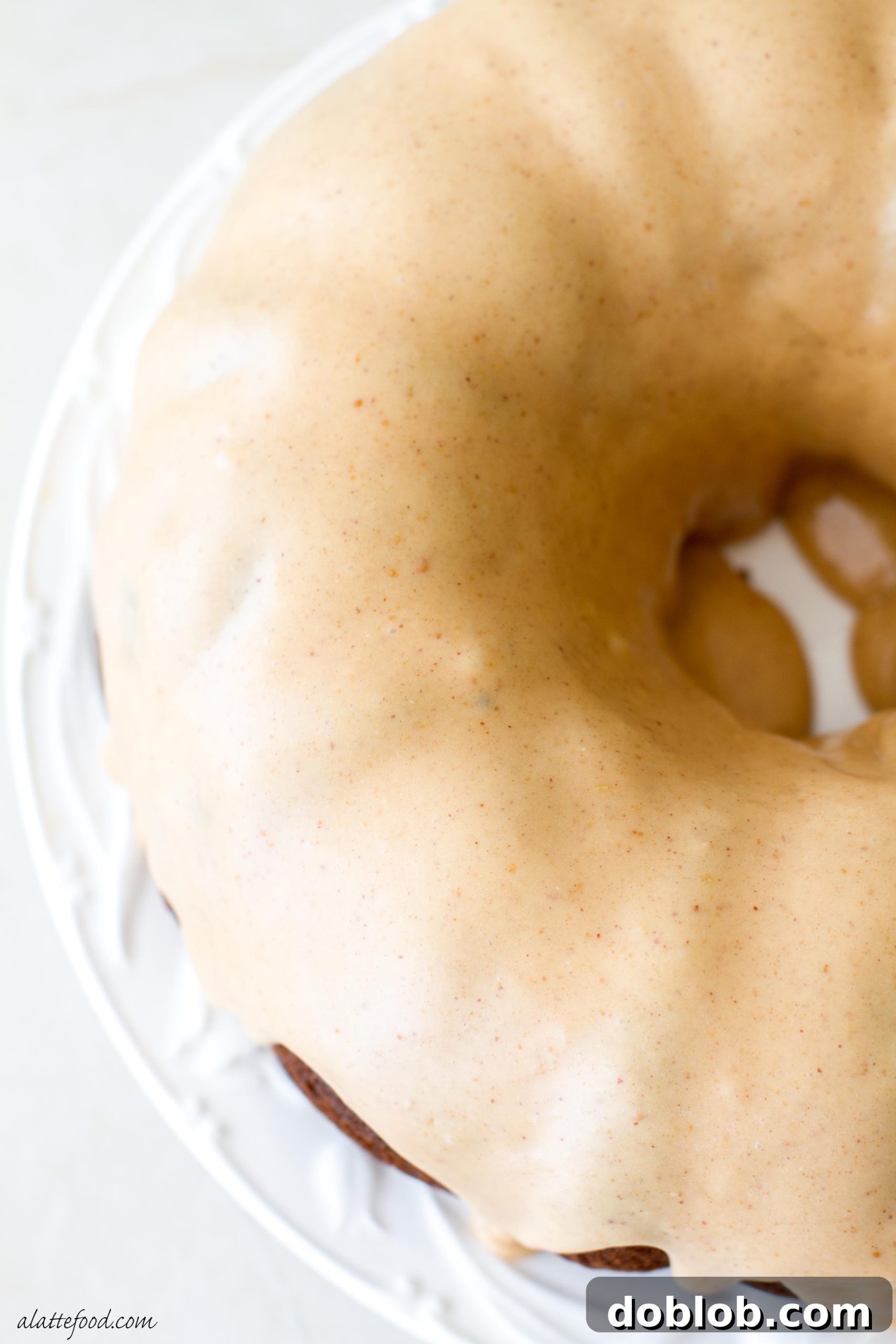 Peanut Butter Drizzled Banana Bundt Dream 3 Another perspective of the peanut butter glazed banana bundt cake, showing its impressive height and the even coating of the delicious glaze.