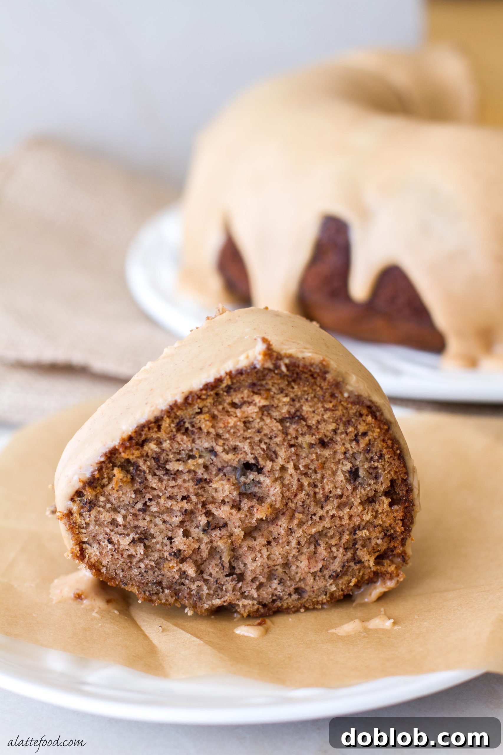Peanut Butter Drizzled Banana Bundt Dream 4 A final close-up of a slice of banana bundt cake, highlighting the rich texture of the cake and the perfect consistency of the peanut butter glaze.