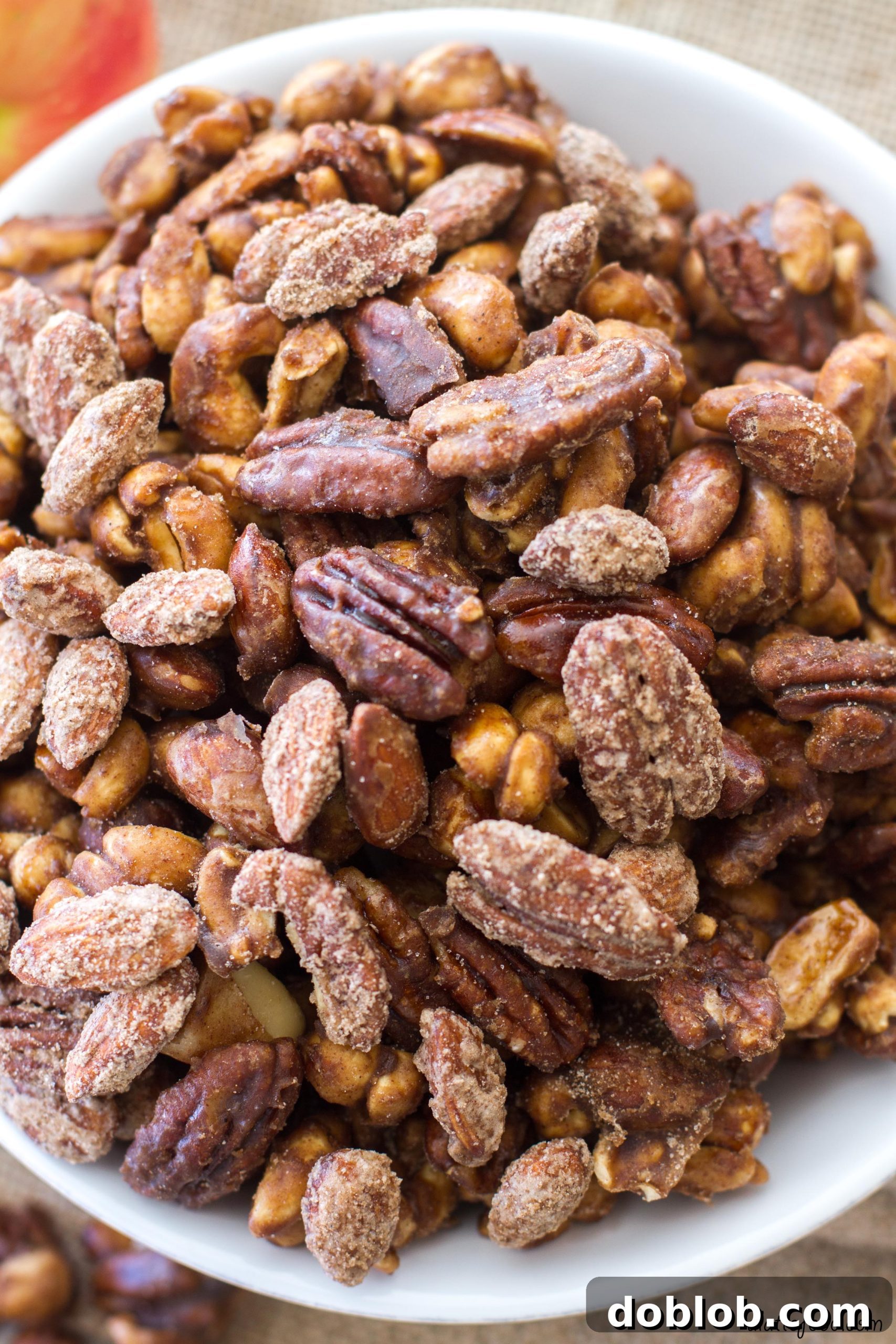 A beautifully arranged selection of nuts, including almonds, cashews, and pecans