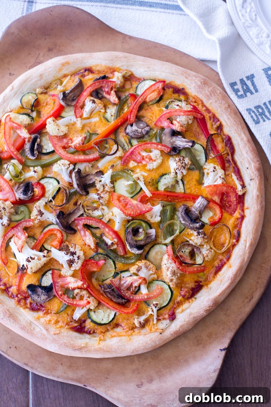 Golden brown Roasted Vegetable Pizza with melted Sargento cheese