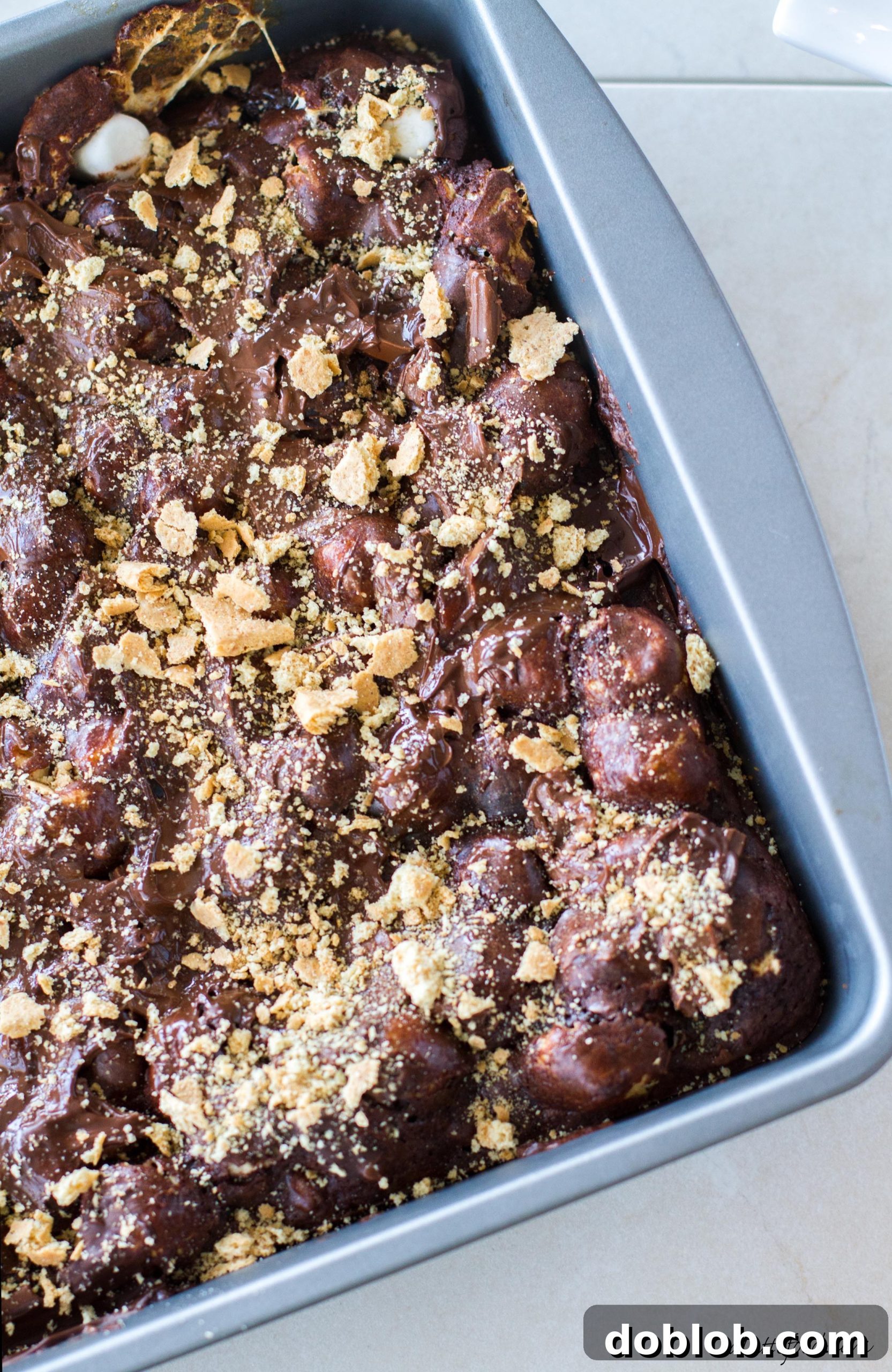 Ooey Gooey S'mores Brownies 5 Stack of rich s'mores brownies on a rustic board
