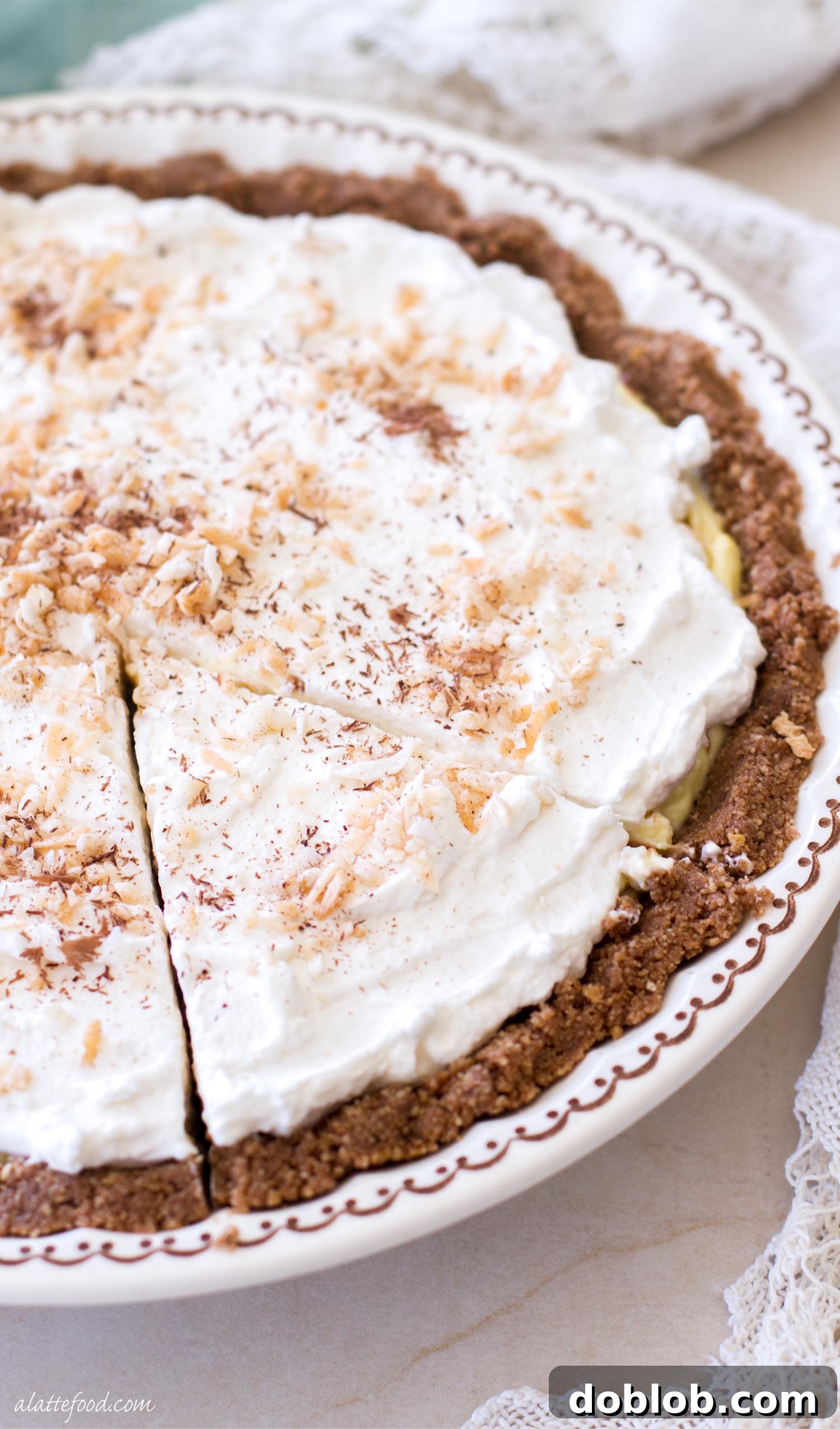 Cool and Creamy No-Bake Chocolate Coconut Pie 4 Close-up of the smooth, creamy layers of chocolate and coconut filling in a no-bake pie, ready for the whipped cream topping.