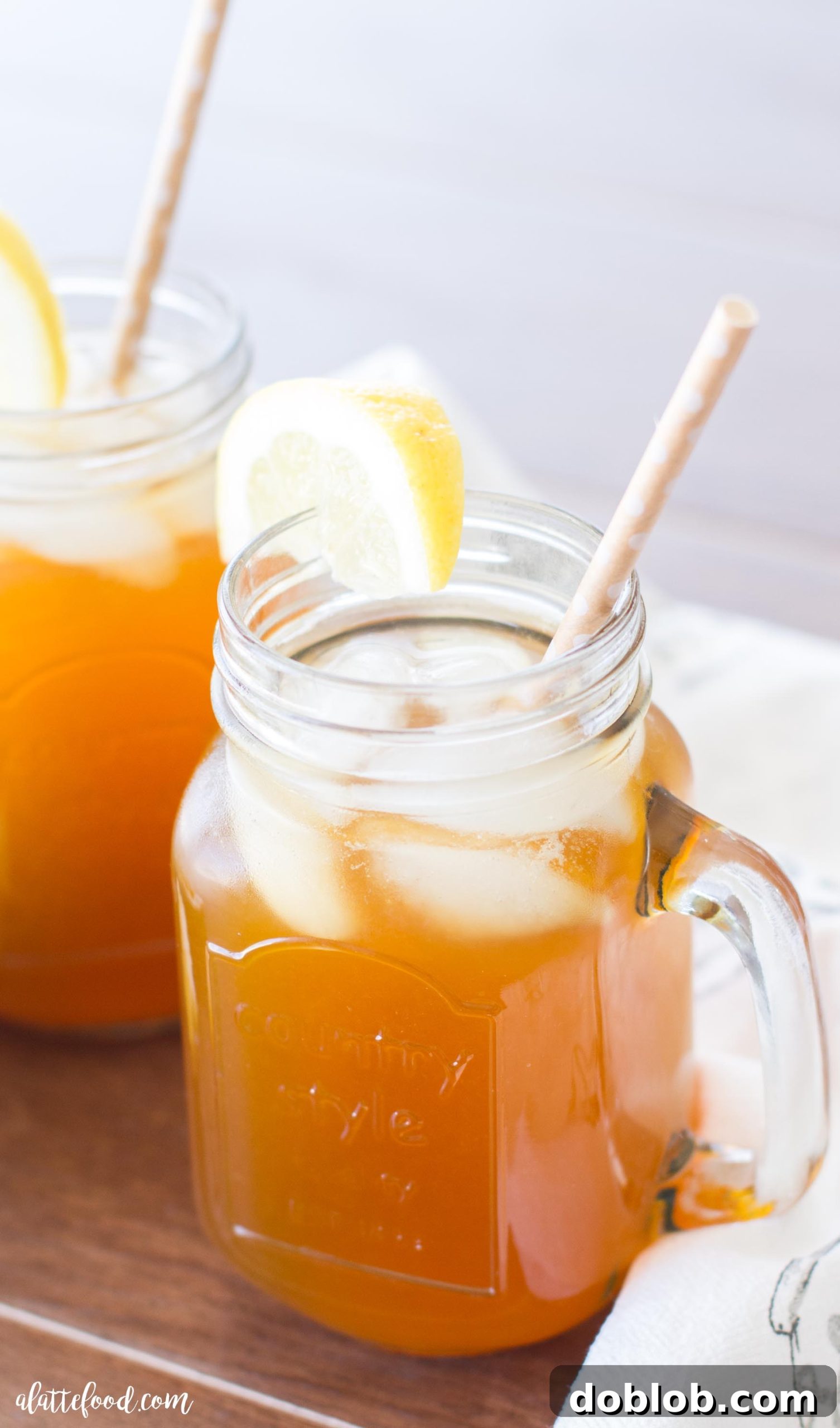 Glass of Apricot Lemon Iced Tea with fresh lemon slices