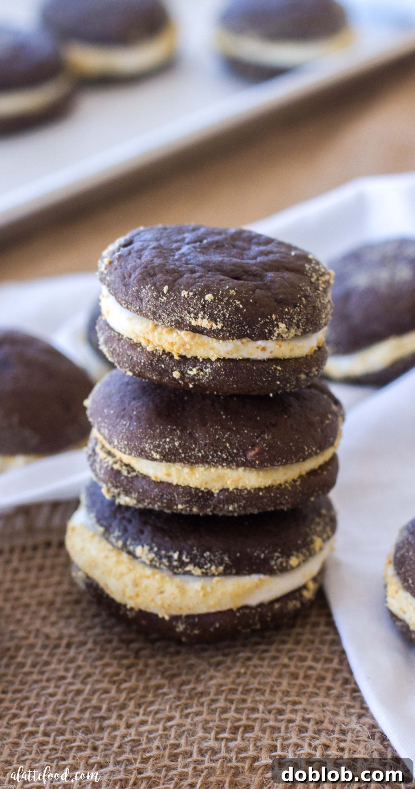 Campfire Whoopie Wonders 4 Stacked S'mores Whoopie Pies with a clear view of the thick marshmallow filling