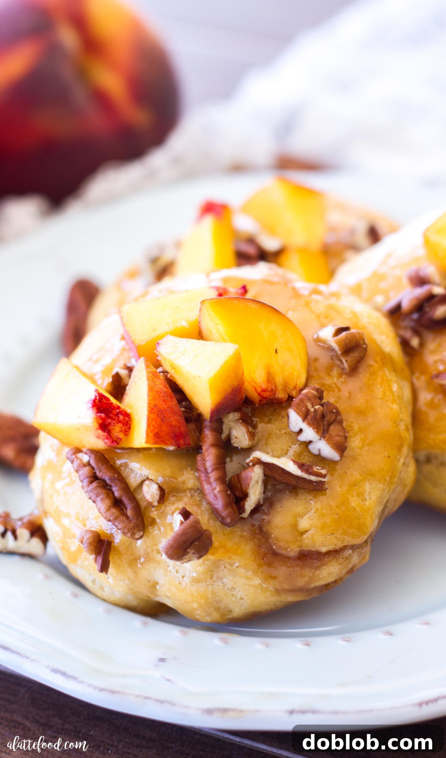 Deliciously warm peach pecan sticky buns made with canned biscuit dough, ready in under 30 minutes.