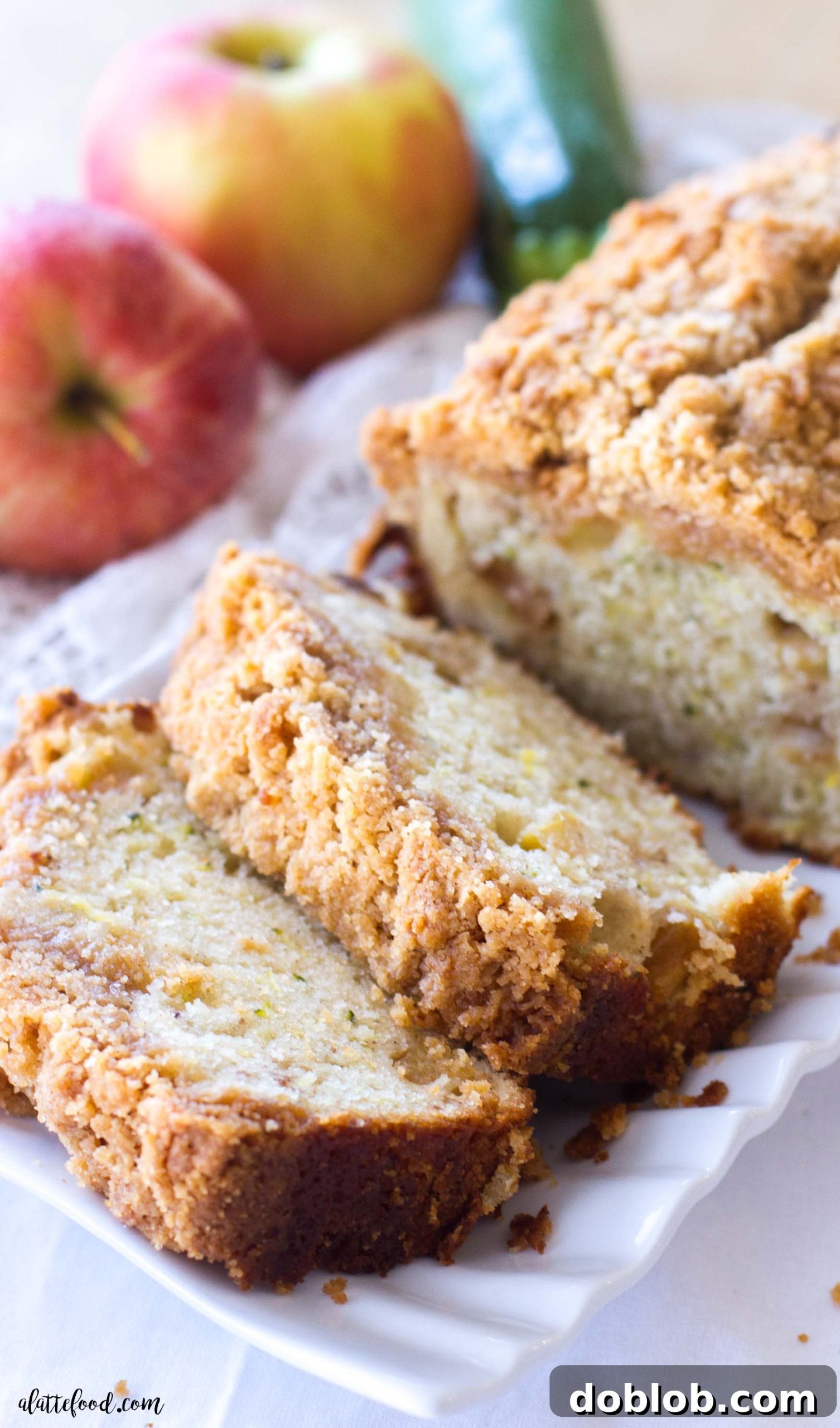 Multiple slices of Zucchini Apple Crumb Bread artfully arranged, ready to be served, emphasizing its appeal as a breakfast or dessert item.