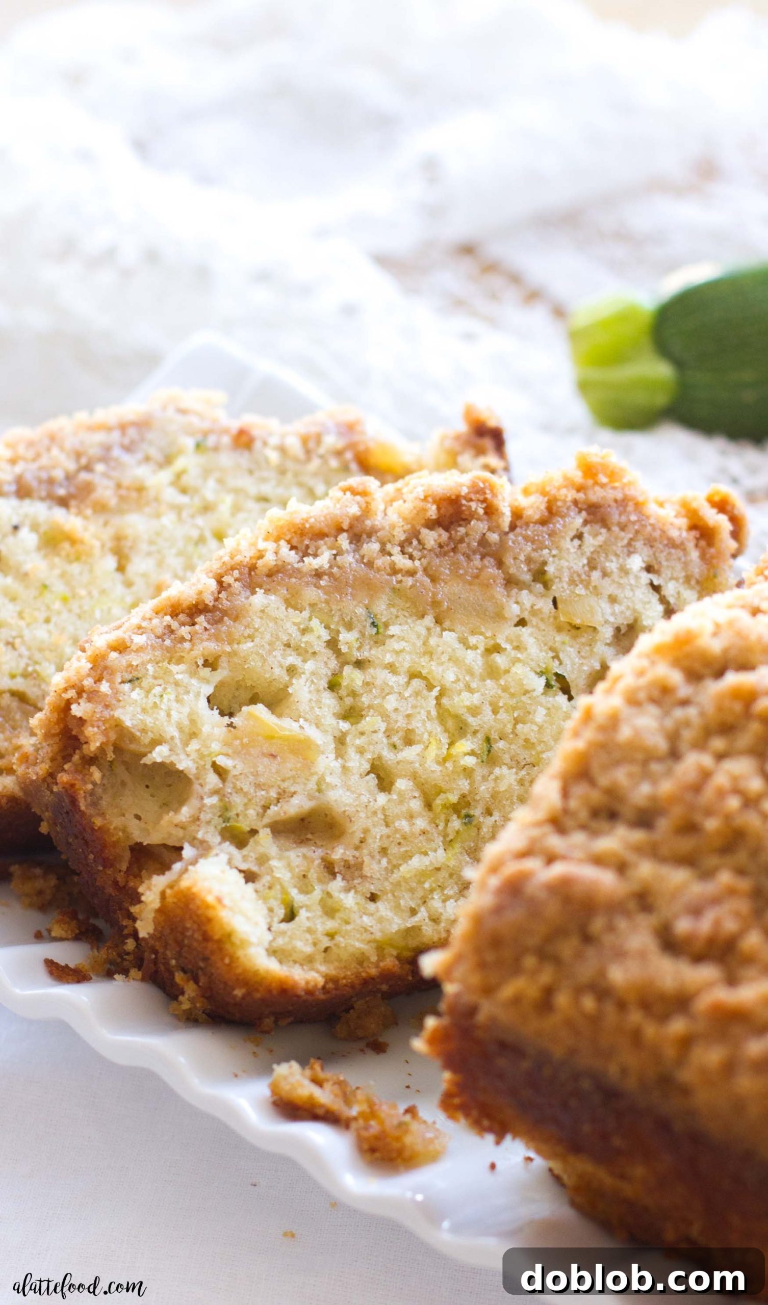 Delicious Zucchini Apple Crumb Bread, baked to perfection with a golden topping, ready to be enjoyed as a fall treat.