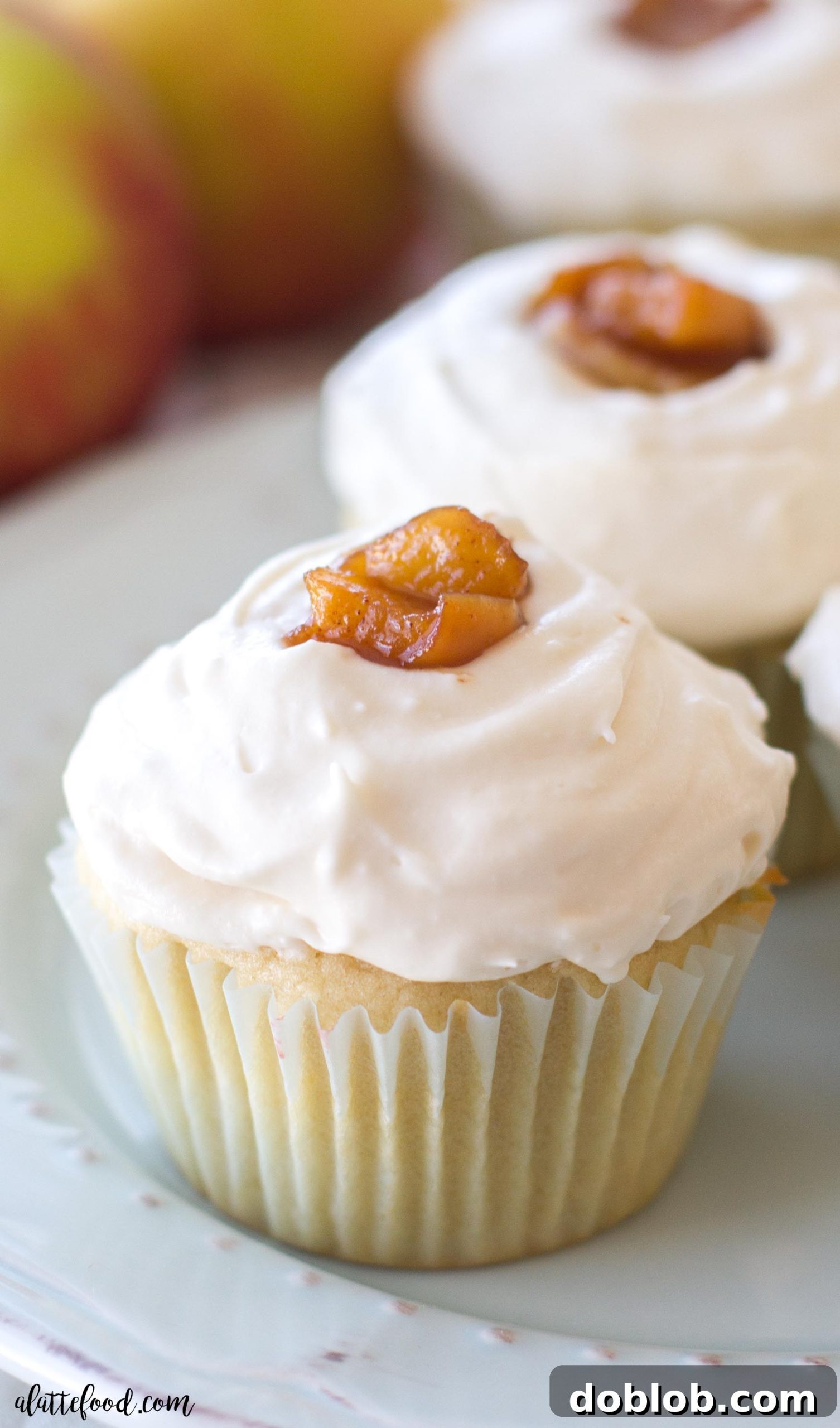 Spiced Apple Delights 4 A beautifully arranged plate of apple pie cupcakes, showcasing their homemade appeal and rich texture.
