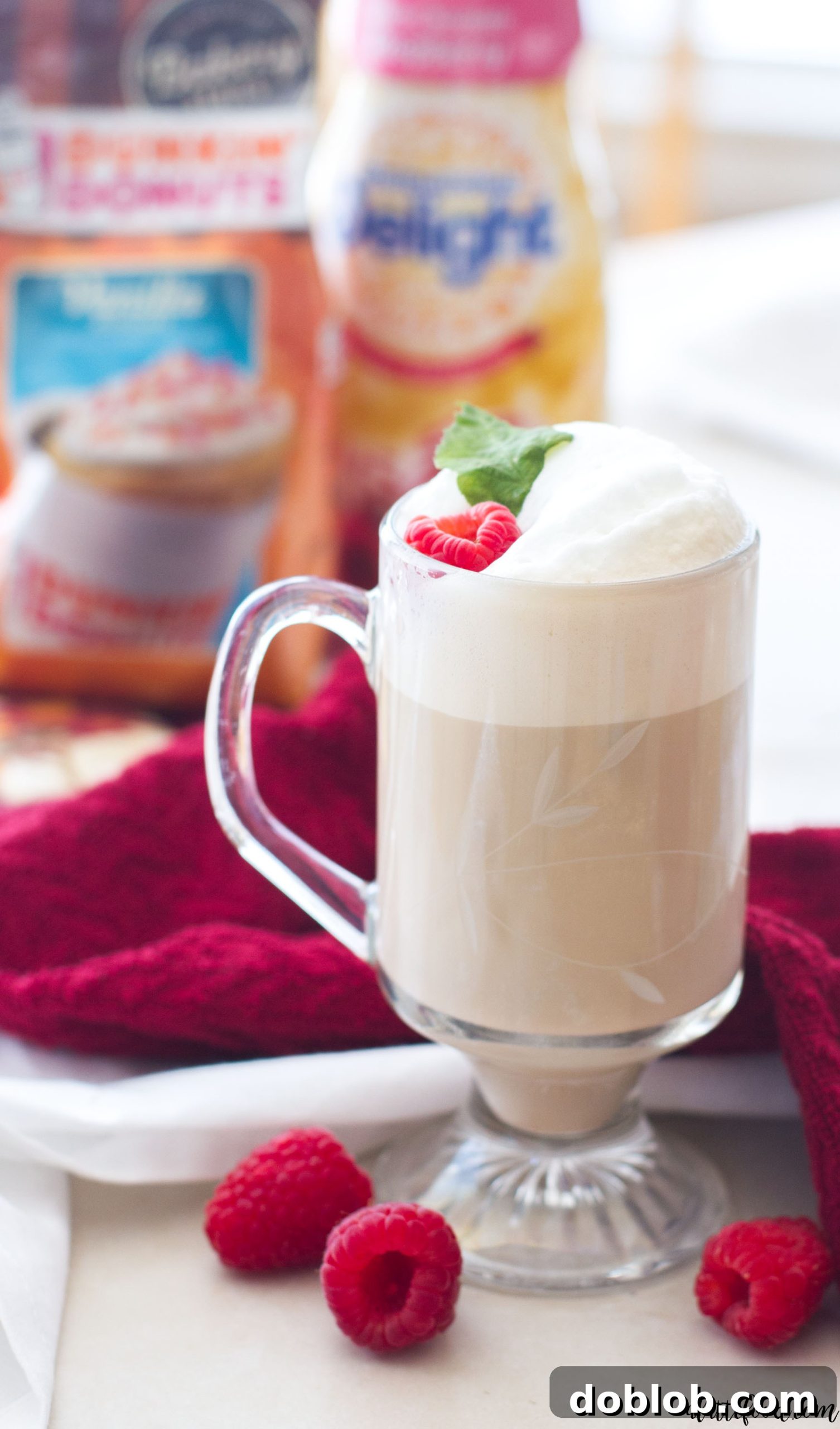 A third image of the White Chocolate Raspberry Vanilla Latte, beautifully styled on a wooden surface, highlighting its comforting appeal.