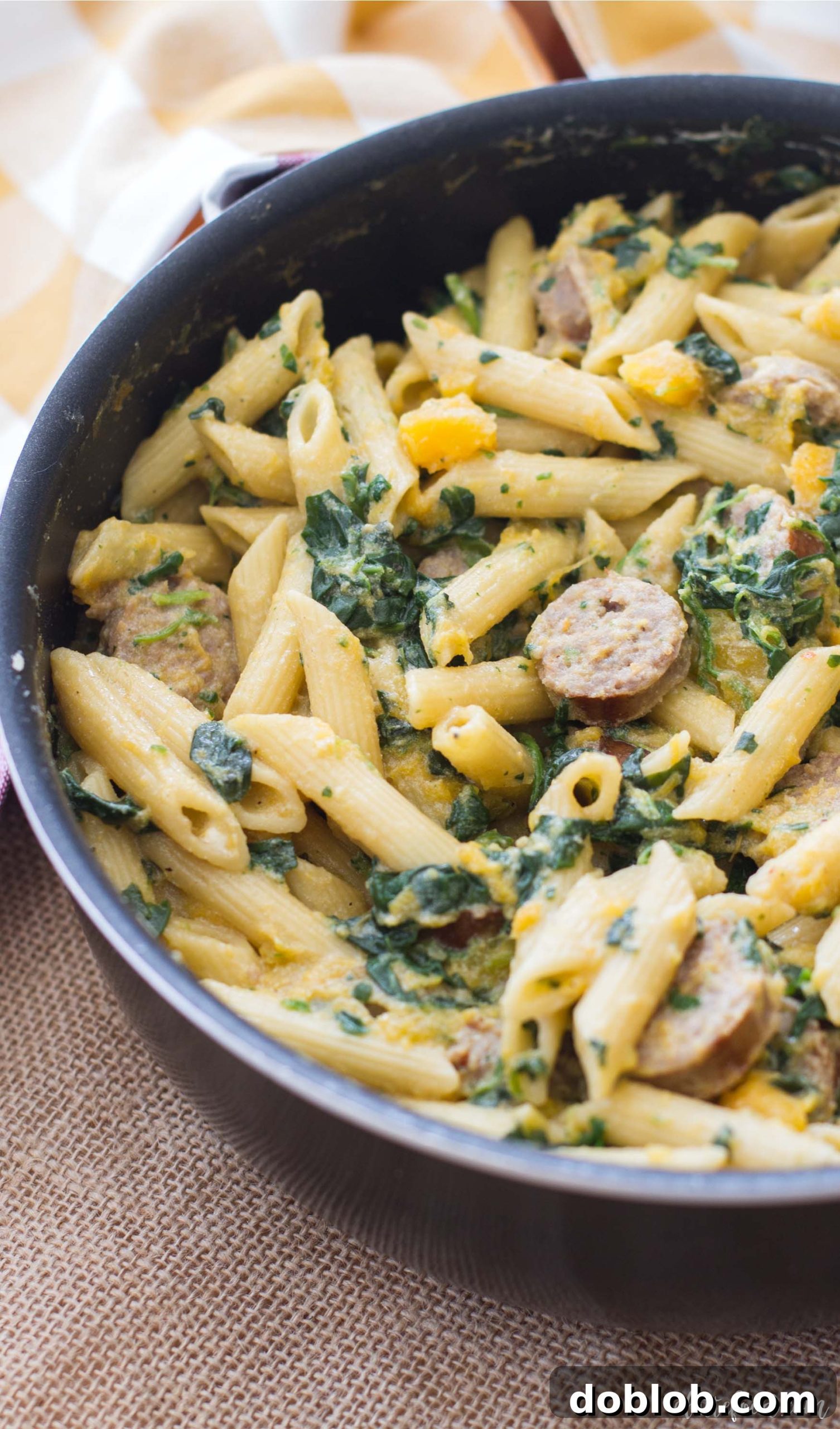 Close-up of Butternut Squash, Spinach, & Johnsonville Sausage Penne pasta.