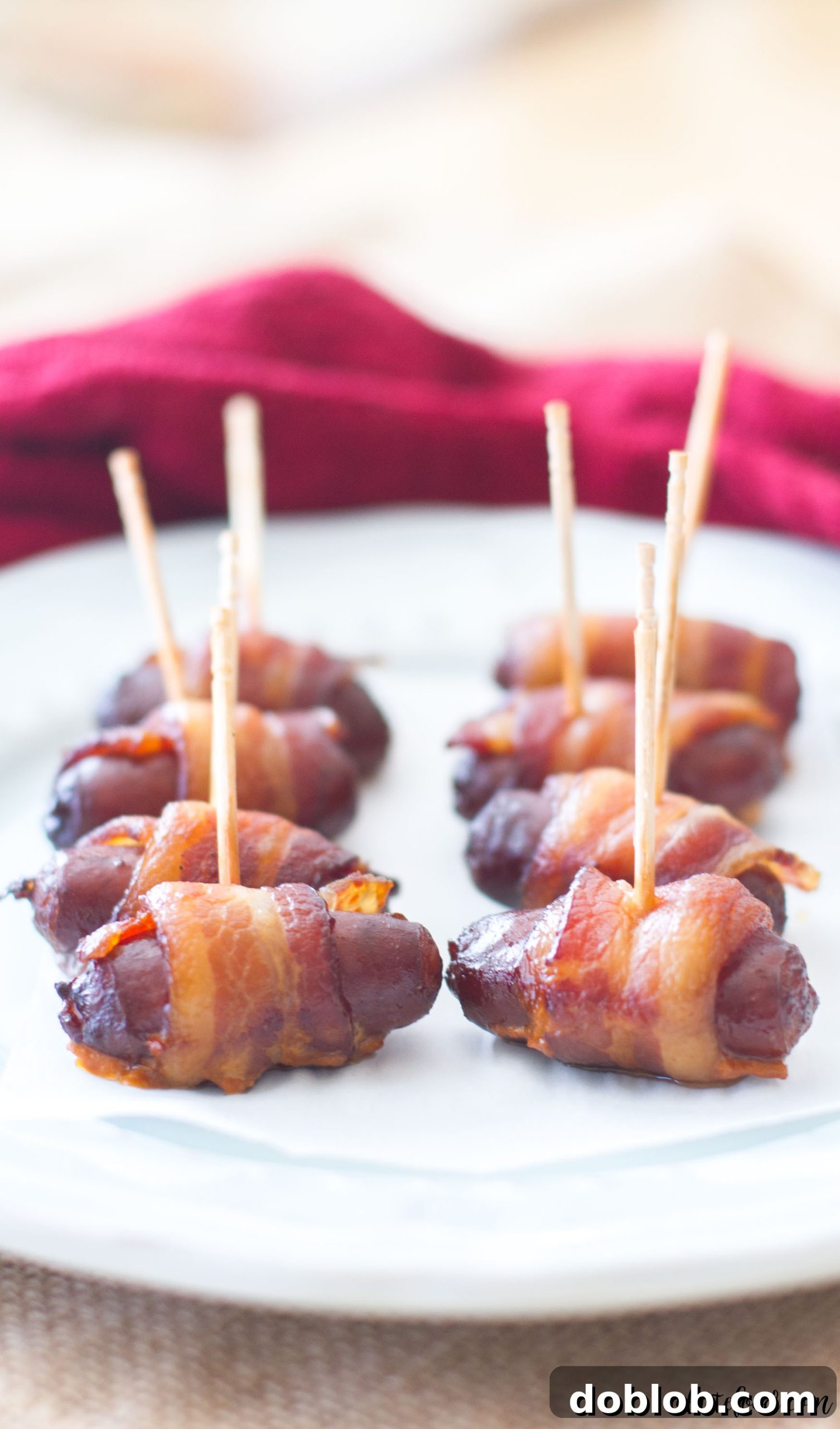 Up-close shot of a platter of Slow Cooker Peach Barbecue Bacon Wrapped Smokies, ideal for Friendsgiving.