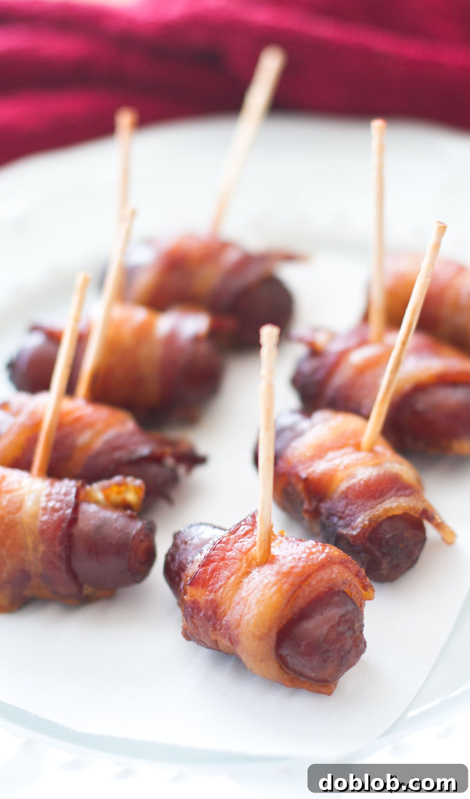 Slow Cooker Peach Barbecue Bacon Wrapped Smokies, served warm and ready to eat.