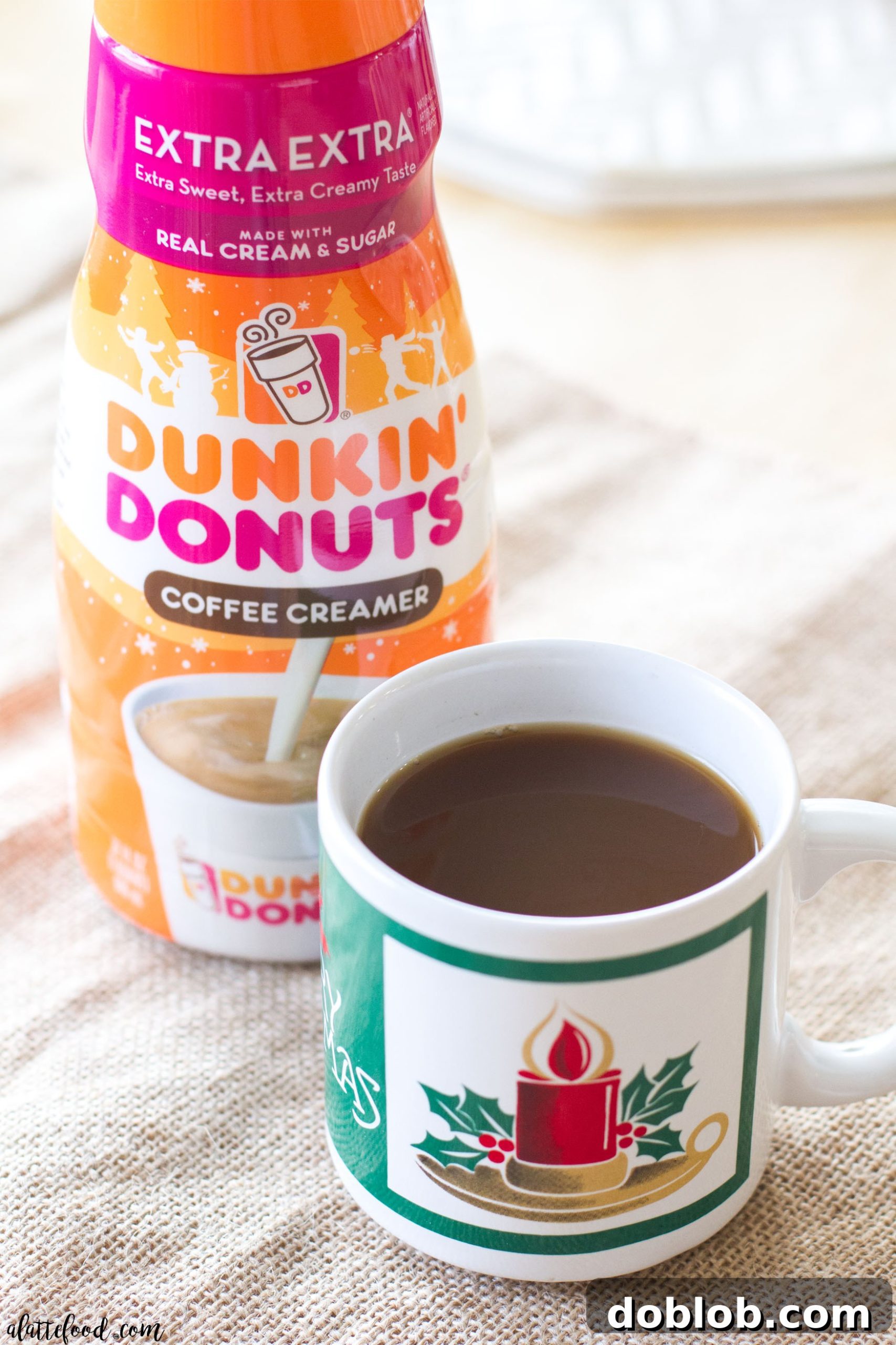 A close-up of baked chocolate donuts, generously coated with a smooth chocolate peppermint glaze and sprinkled with vibrant crushed peppermint candies, making them a festive and delicious holiday treat. #peppermint #mocha #donut #chocolate #christmas These easy baked chocolate donuts are filled with coffee and rich chocolate, and topped with a chocolate peppermint glaze. The perfect Christmas dessert! A simple chocolate donut recipe you're sure to love!