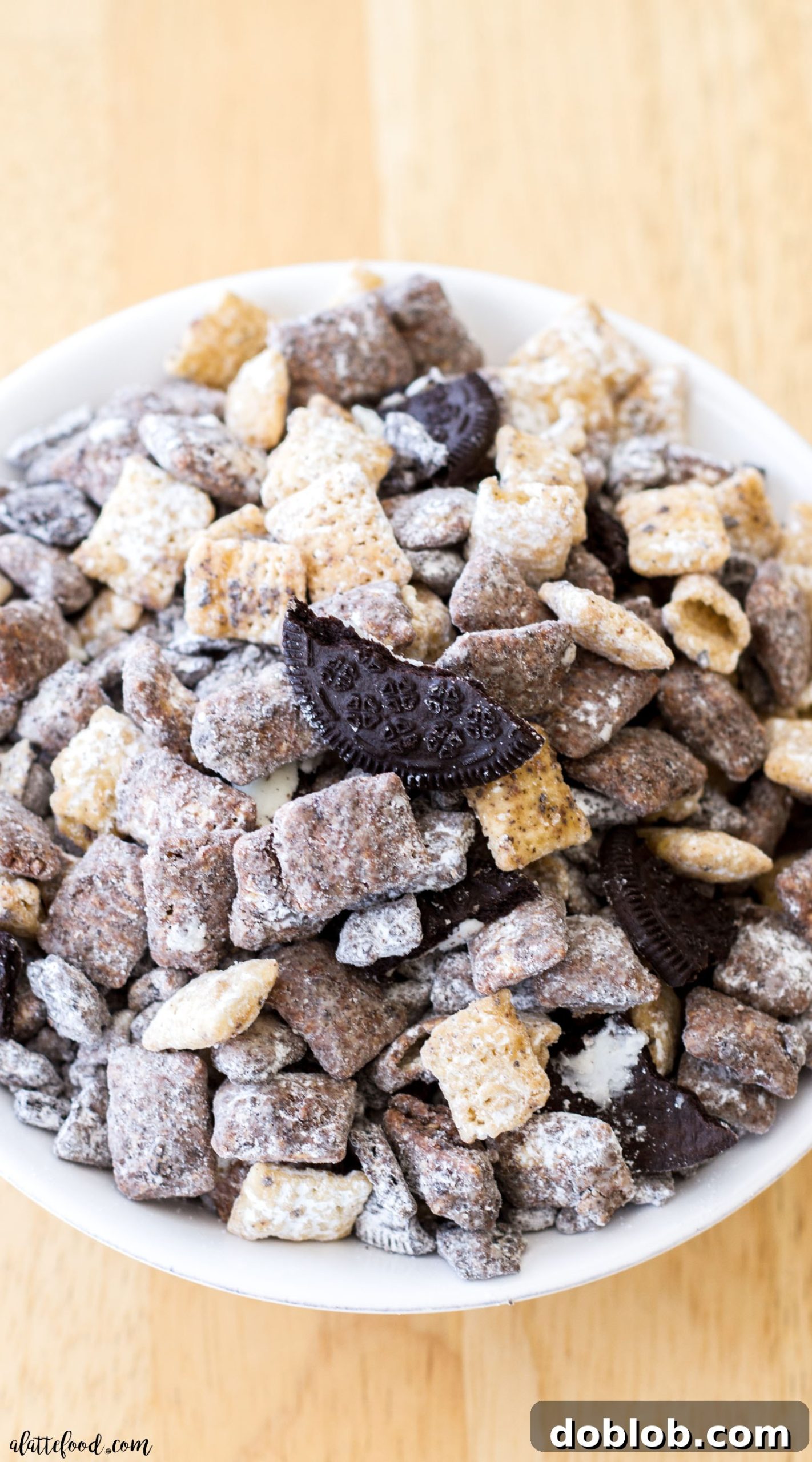 A bowl of Salted Caramel Cookies 'n Cream Puppy Chow, a perfect party snack