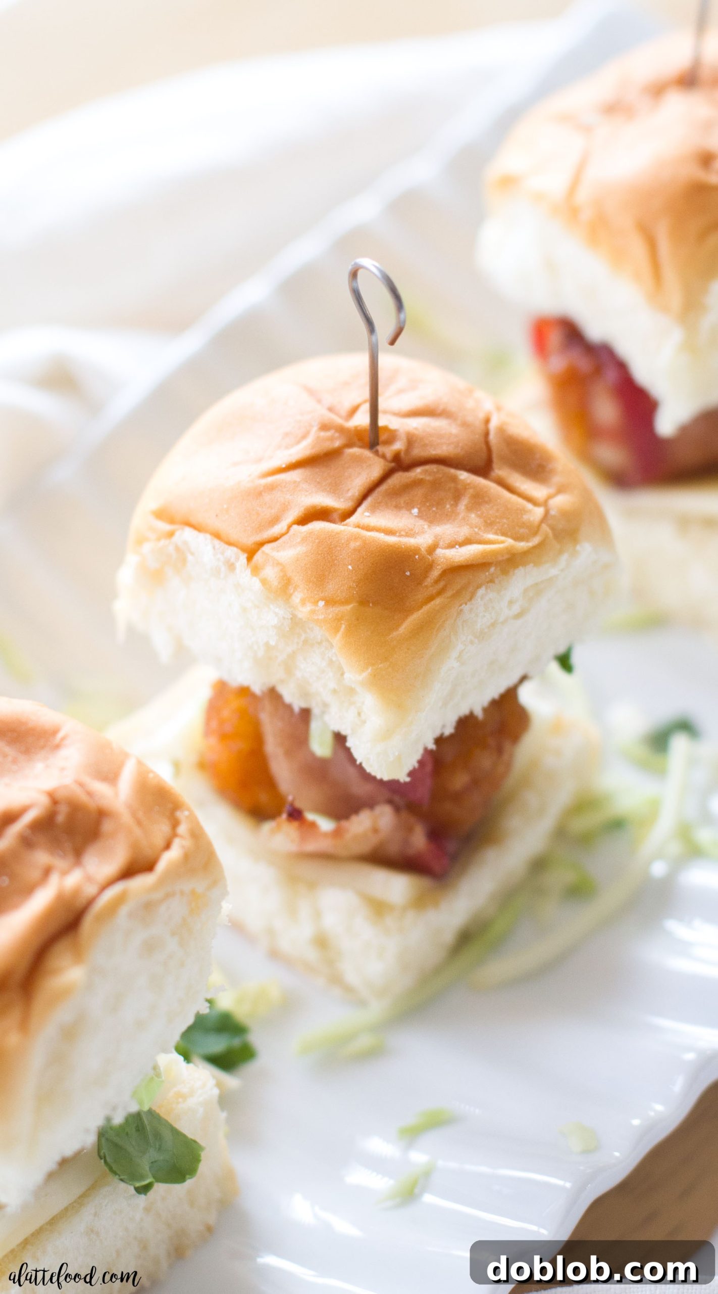 Delicious bacon wrapped honey barbecue chicken sliders, perfect for game day gatherings
