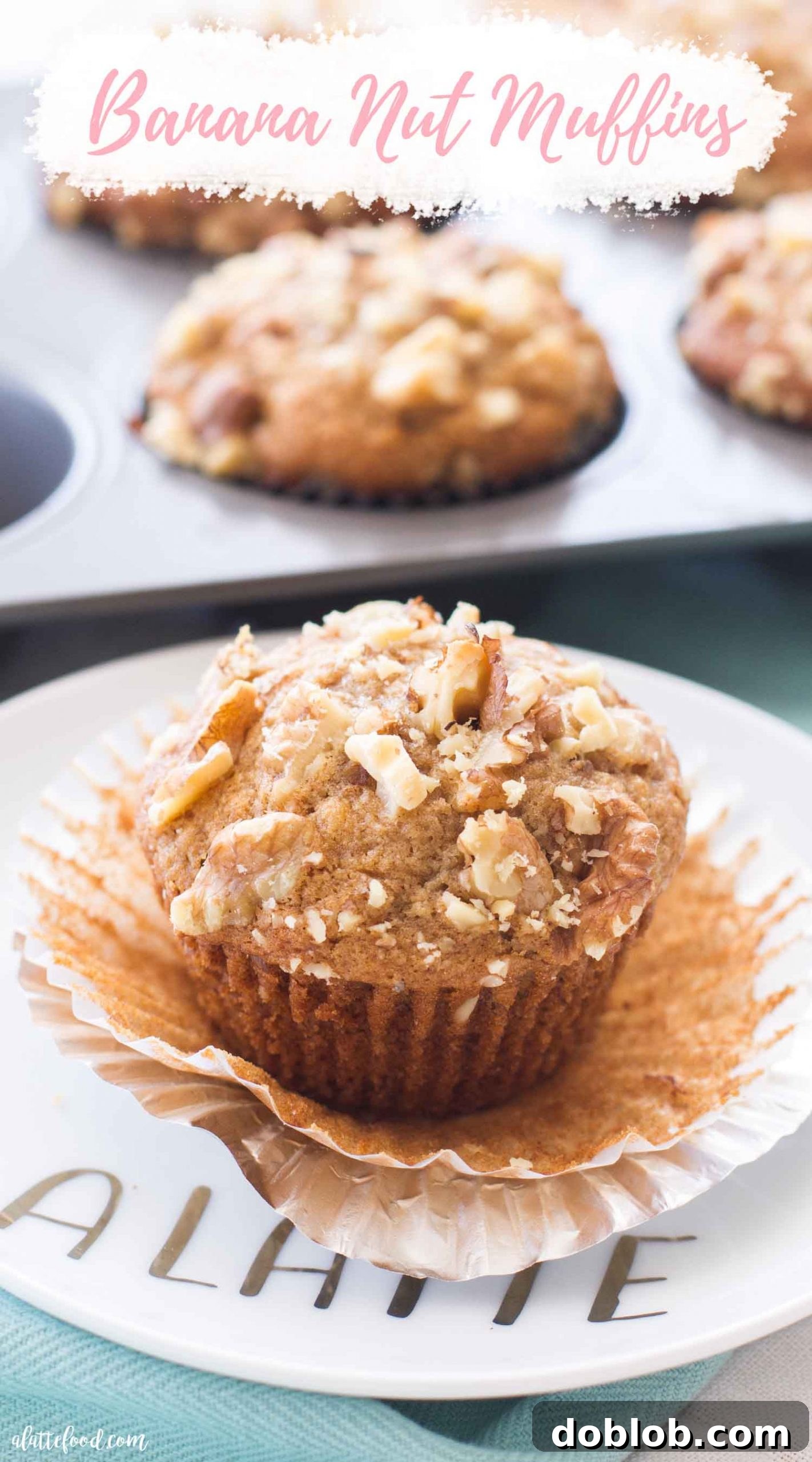 The best Banana Muffins definitely come from this Banana Nut Muffin recipe! Moist banana bread meets fluffy muffins to make the absolute best breakfast that’s both sweet and nutty. Of course, you can make these nut free banana muffins, or you can use pecans or almonds instead. Plus, these nutty banana muffins can be made ahead of time and frozen until you need them. An easy breakfast recipe! #breakfast #banana #muffin #homemade #recipe #easy A single banana nut muffin on a white plate with text overlay, emphasizing its moist and fluffy texture and delicious nutty flavor, perfect for breakfast.